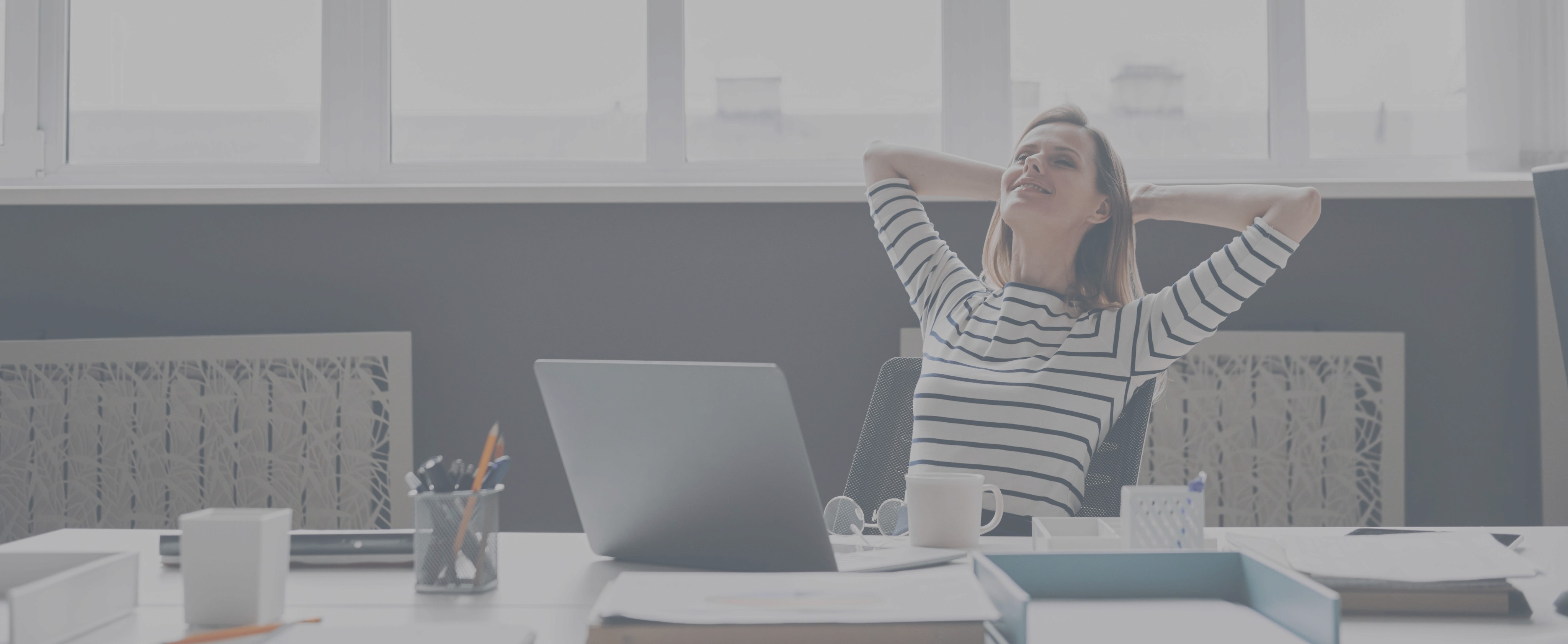 business woman relaxing in front of laptop