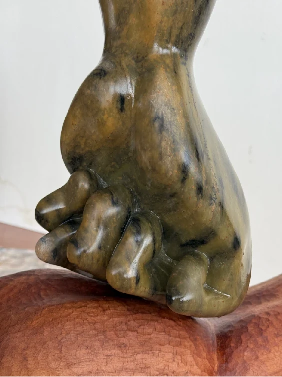 Oppression, 2025. Soapstone, cedar. by Barbara Walker.