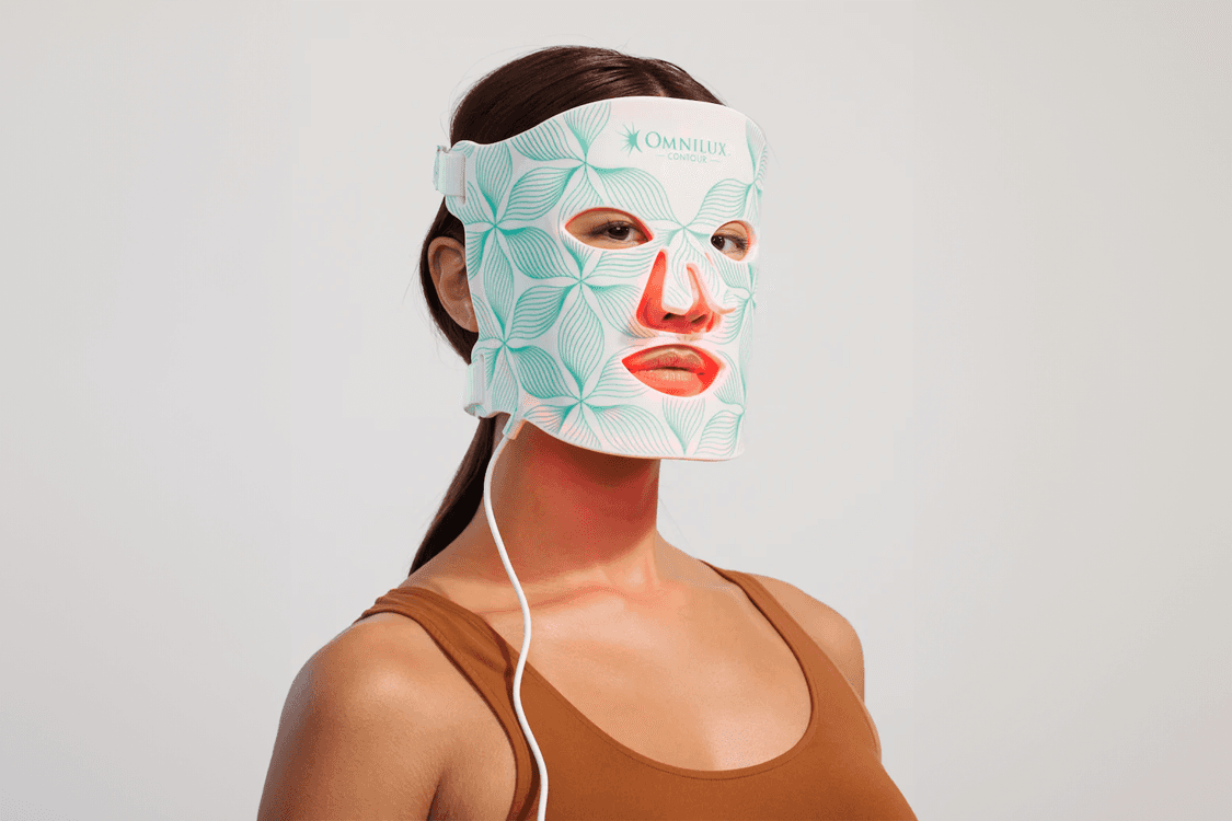 man filming on beach