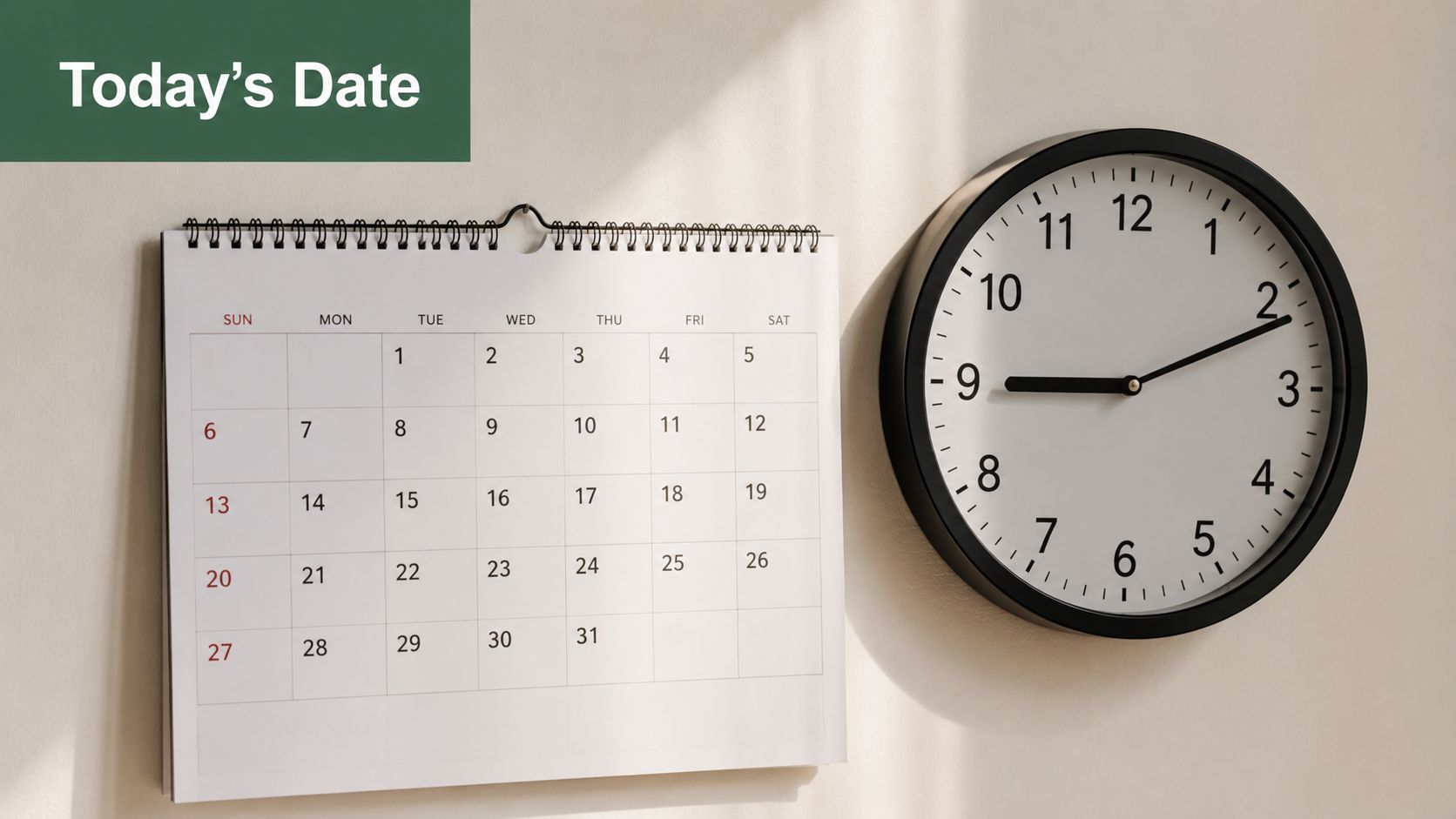 A wall-mounted calendar displaying a month and a circular clock indicating the time as nine-ten.
