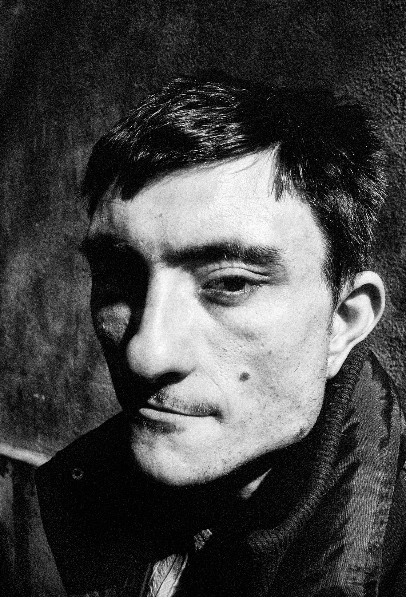 Rodion – Star Behavior – dramatic side profile with a gloved hand along the jawline