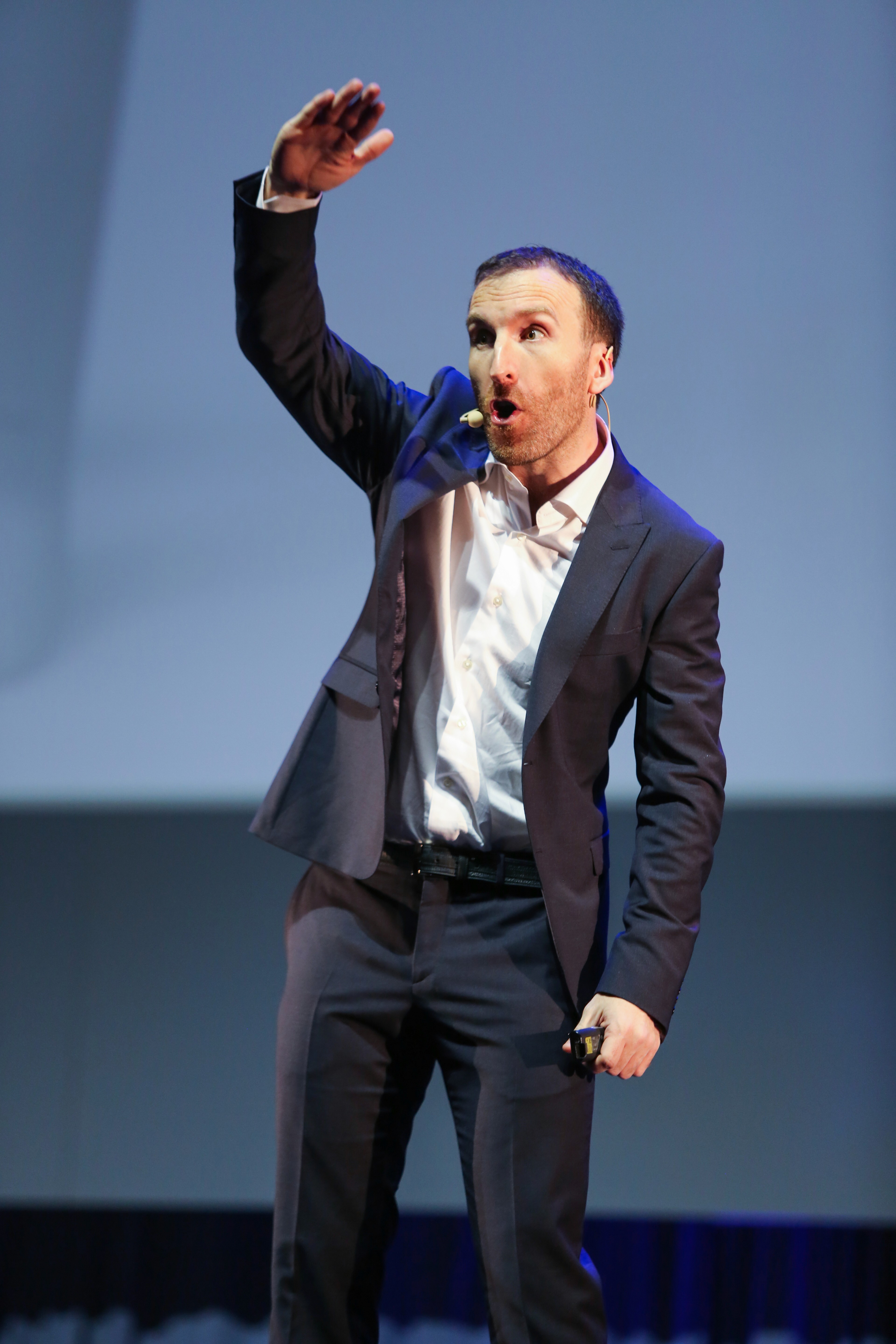 A 3D-rendered pink and white twisted knot sphere with smooth, glossy rope-like texture on a soft pastel background.