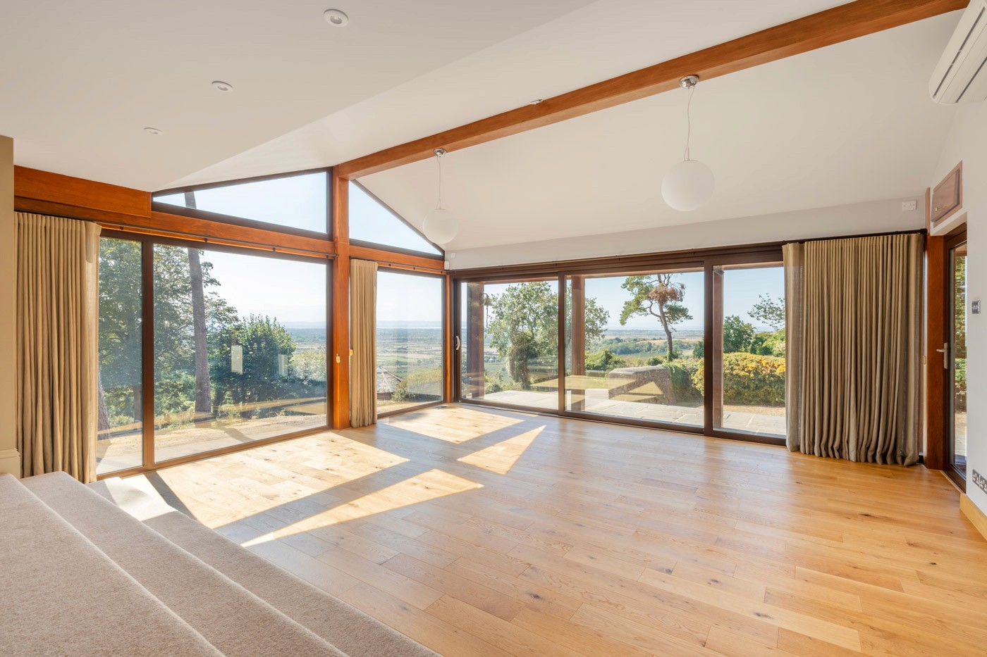 bright living room with floor-to-ceiling glazing and views