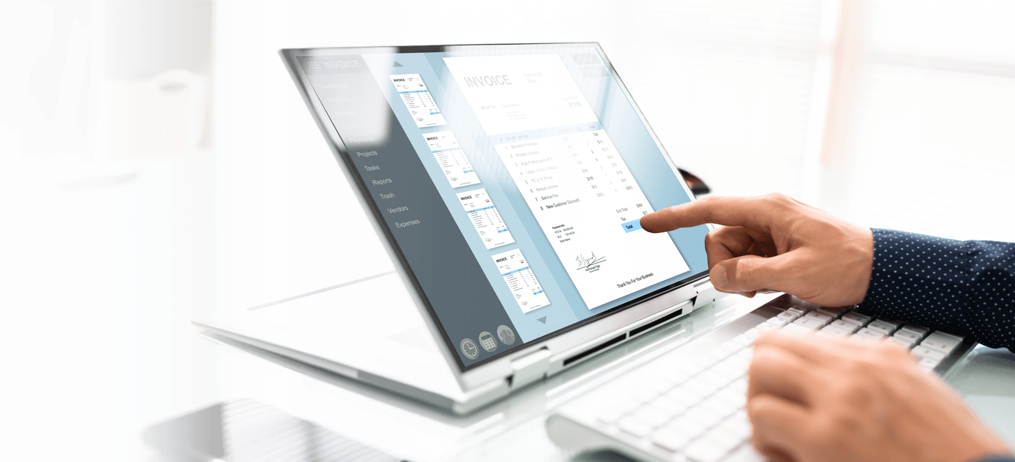 hands of a person using a laptop and keyboard