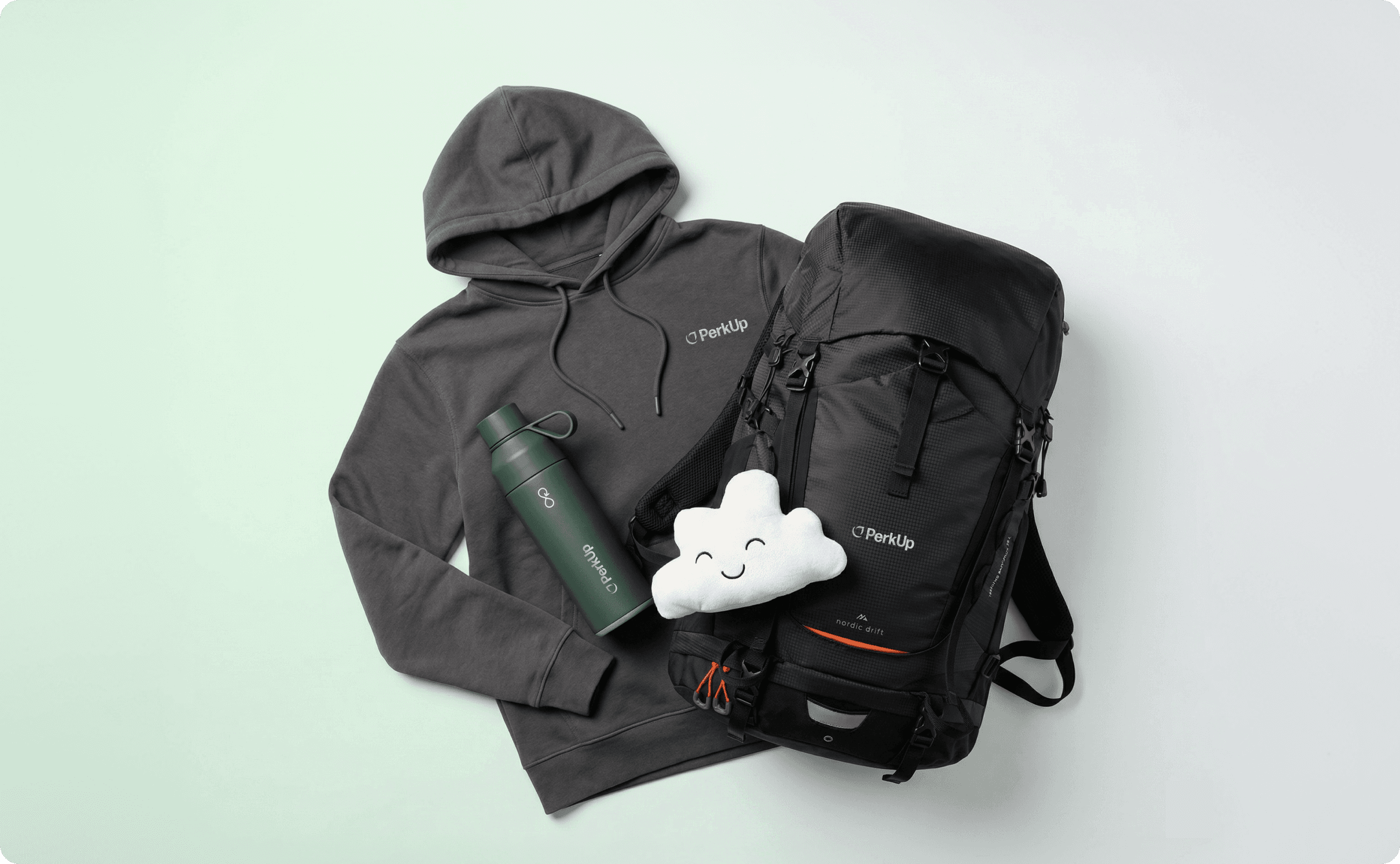 Grey hoodie, dark green flask, a cloud plushie, and backpack, all on top of each other.