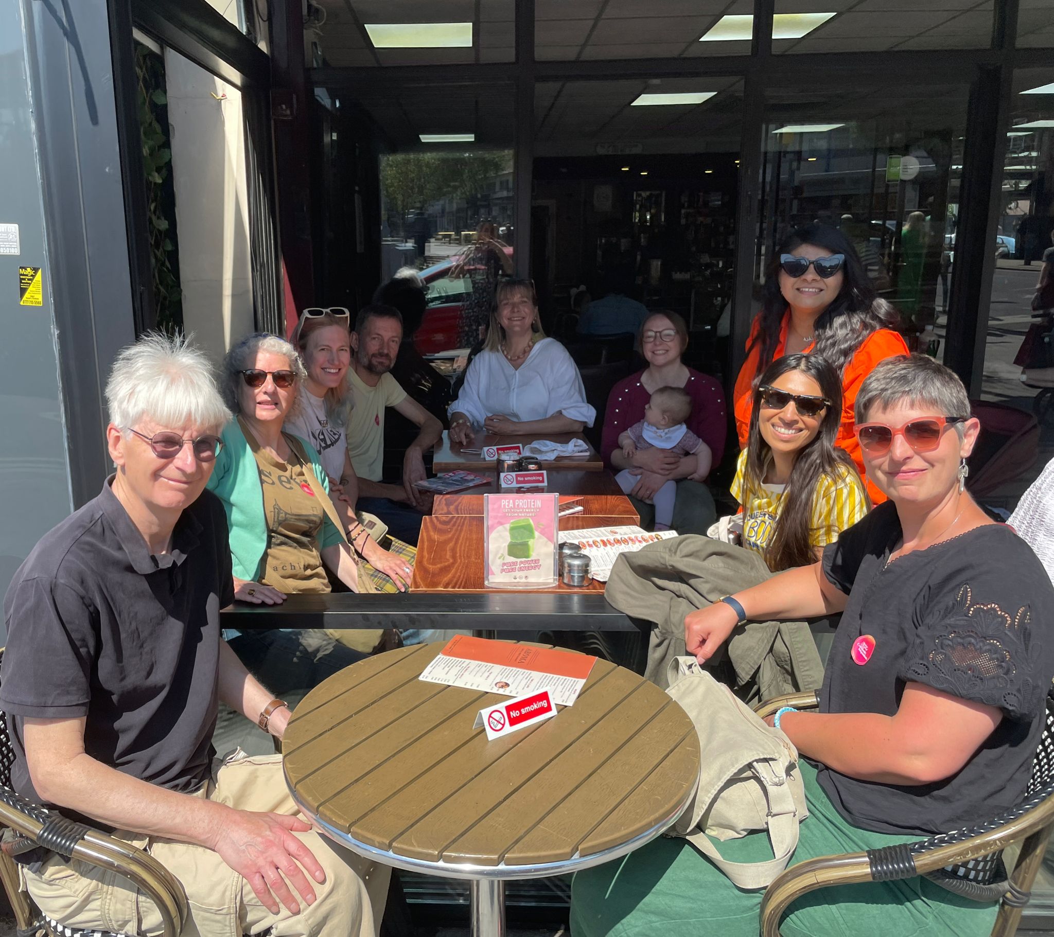 Group of volunteers having a post canvassing coffee break
