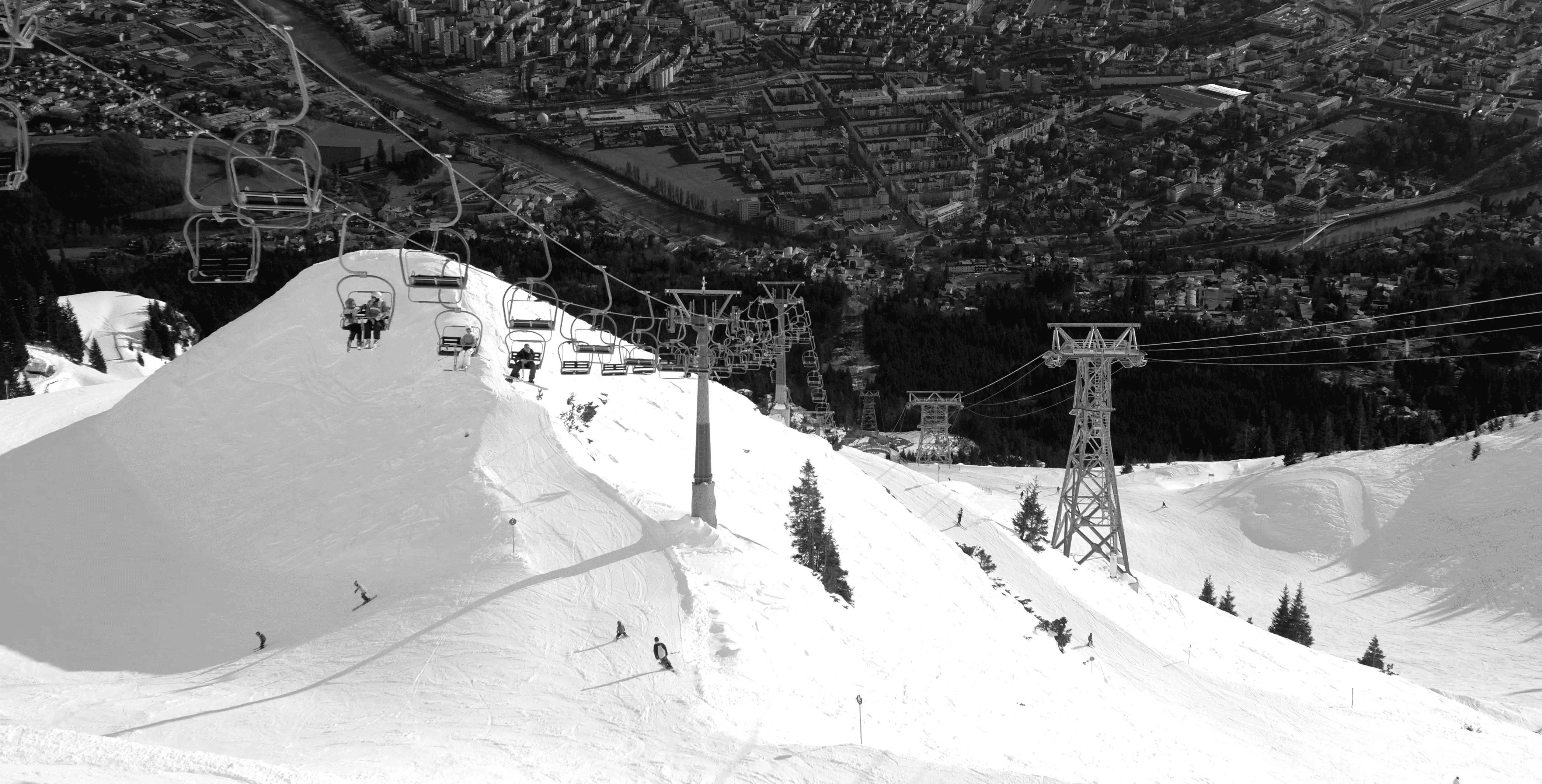 Private Jet Travellers Skiing high above Innsbruck a few minutes after arriving at Innsbruck airport by private jet charter