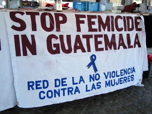 Banner reads "Stop Femicide in Guatemala"