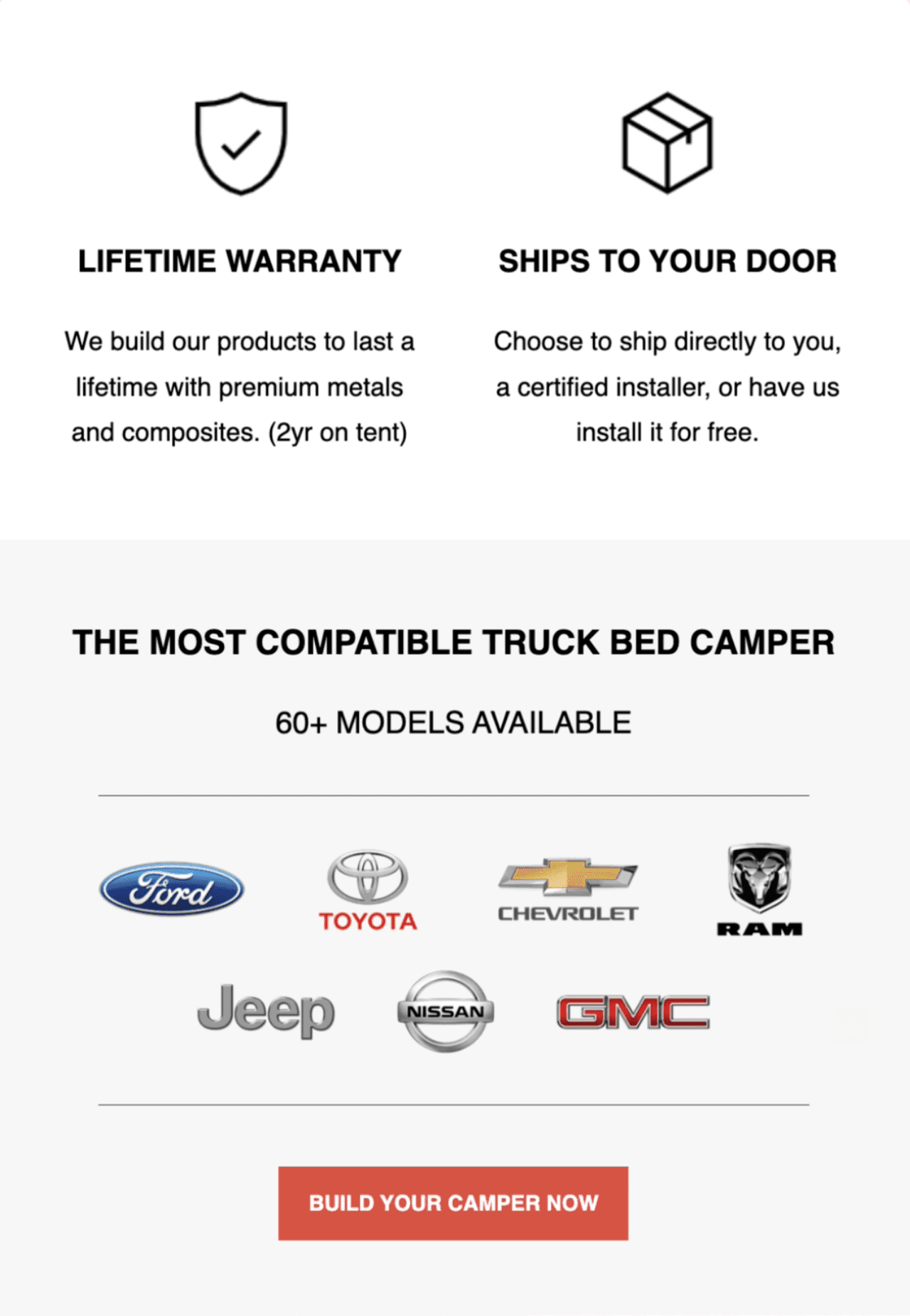 Black and white photo of two people looking at a computer screen with papers on wall