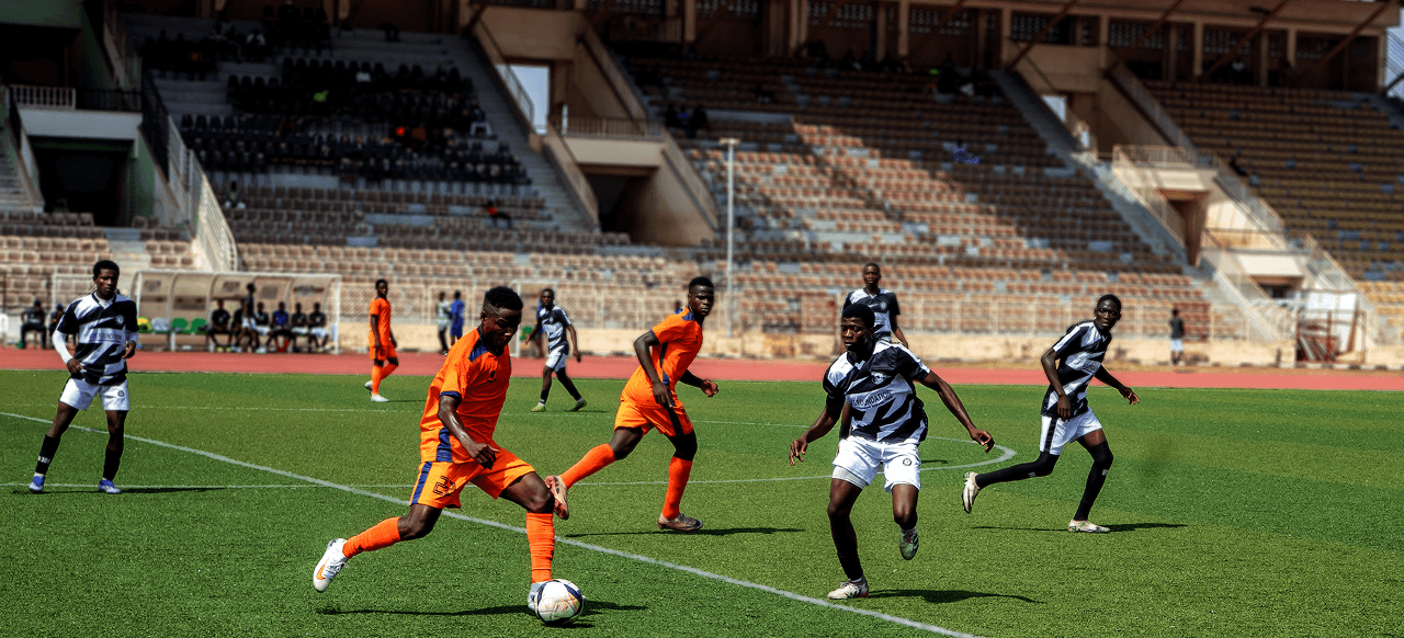 players on the pitch playing football