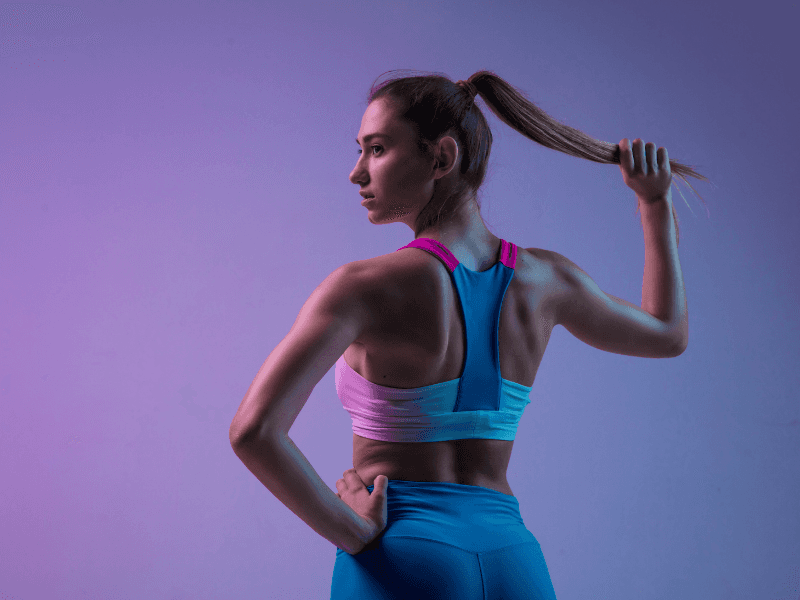 a female in workout clothes with long ponytail