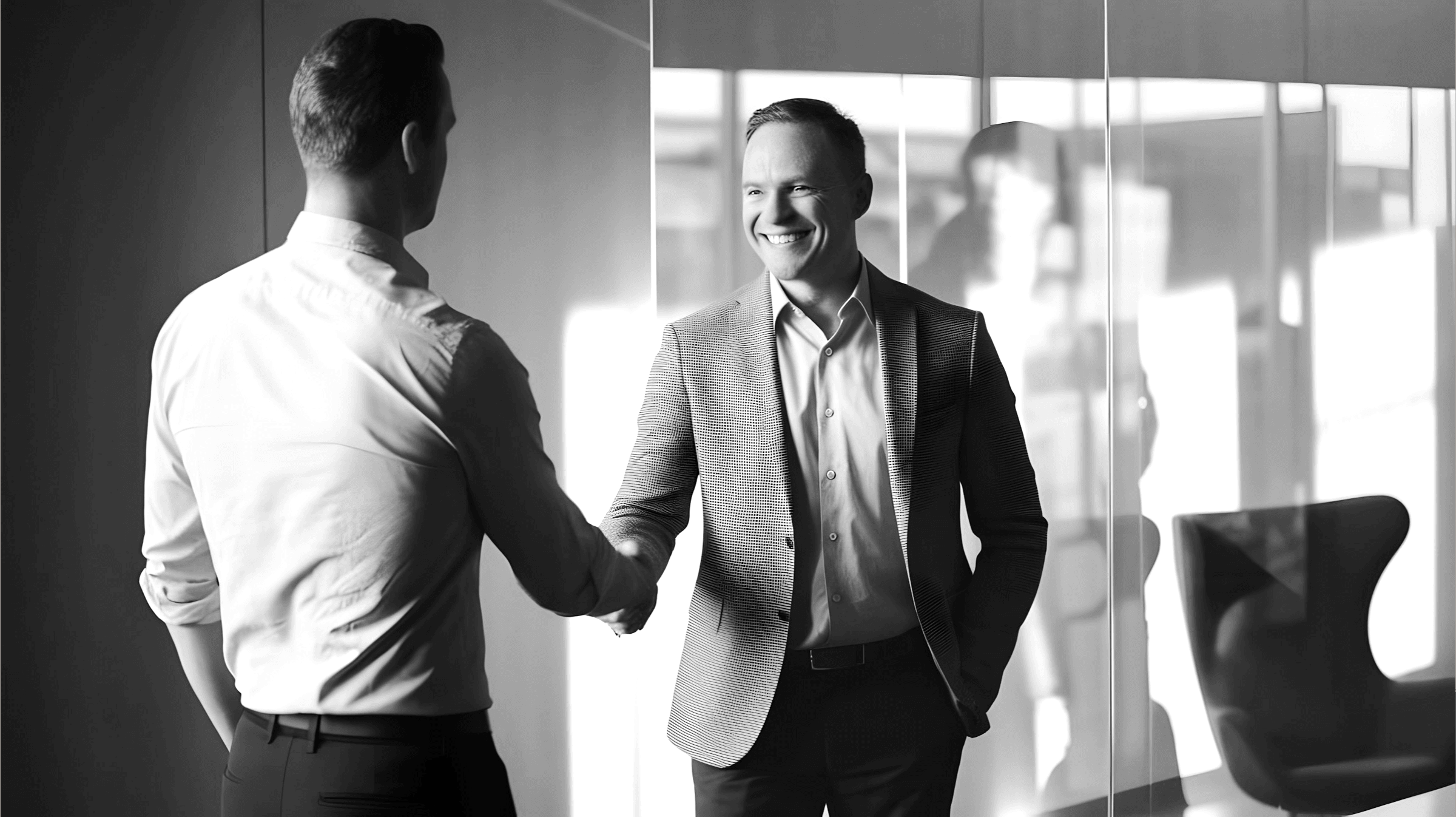 Two men are shaking hands.