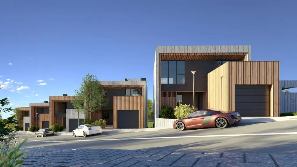 Modern townhouses on a sloped street with wooden facades and luxury cars parked in front.