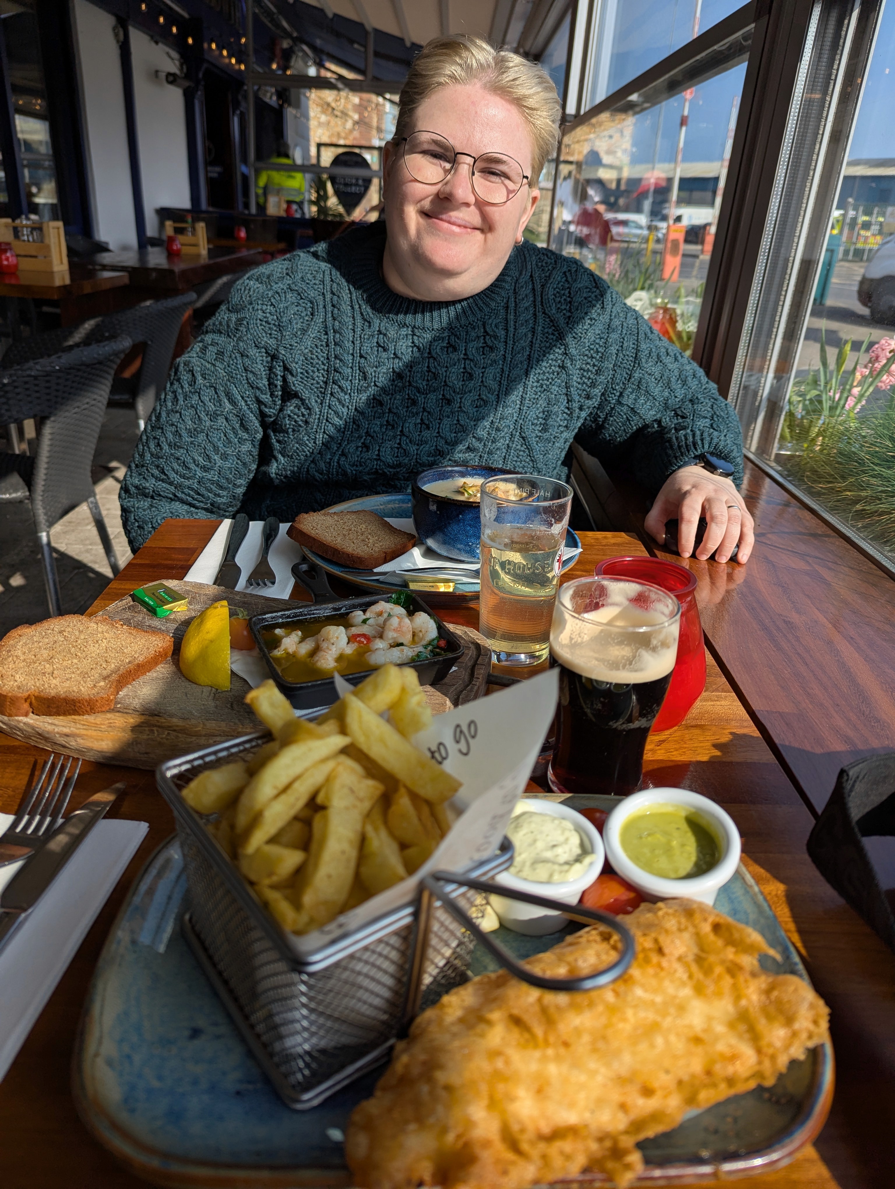 A very Irish portrait (I am in Ireland in a green Irish sweater, having a bowl of seafood chowder and drinking a Cider).