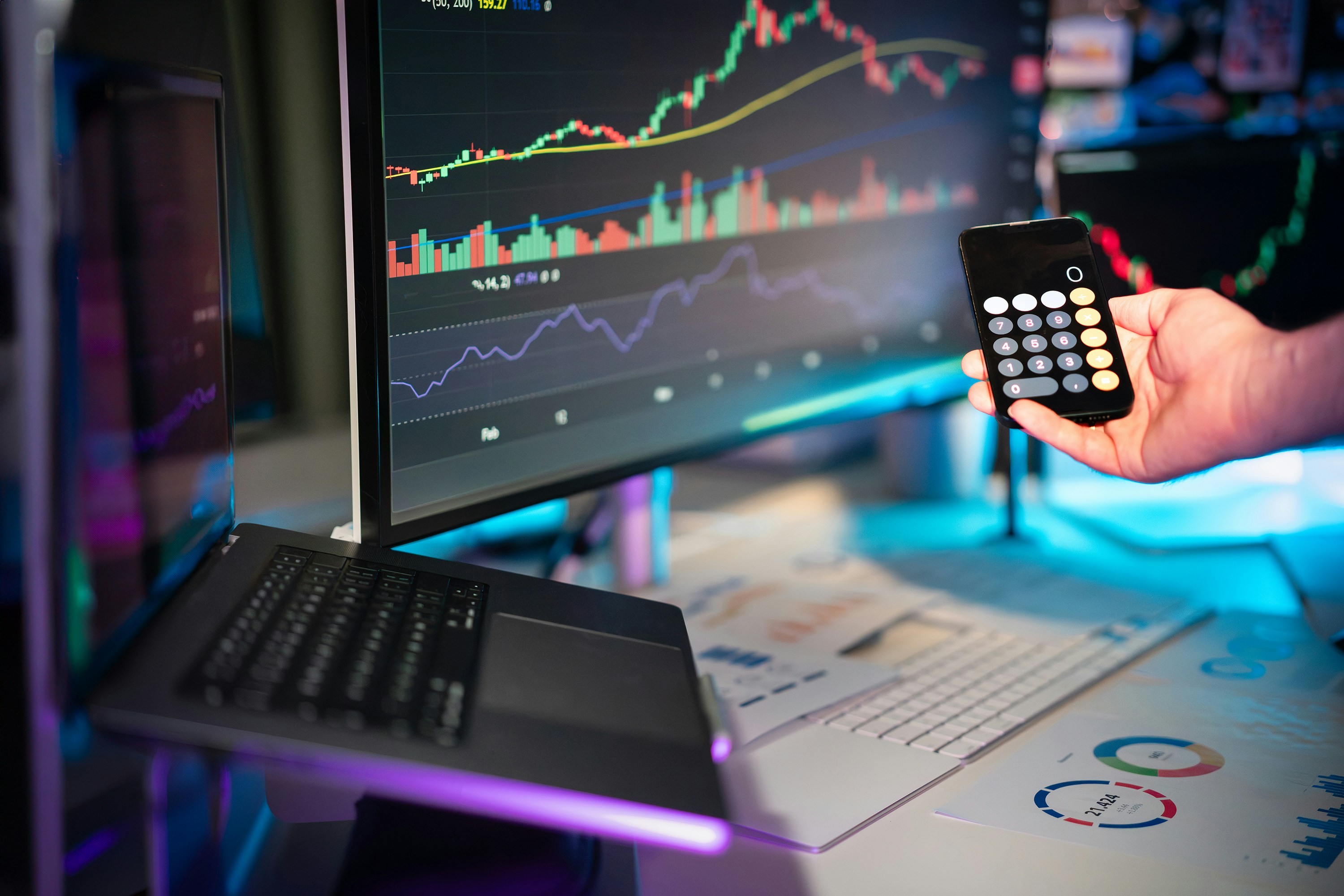 calculator and a trading pc - Crypto Financial Advisor