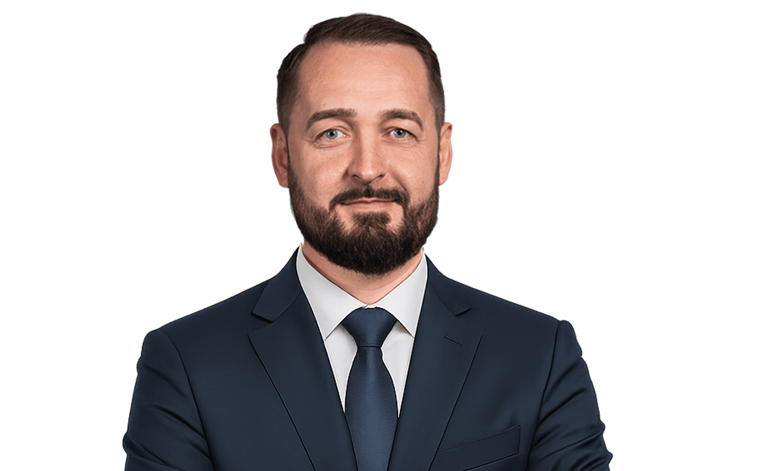 Professional headshot of a woman with short, wavy brown hair wearing a black blazer and white shirt.