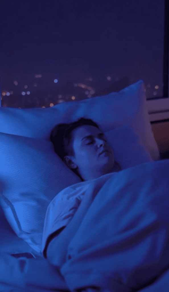 Woman using Sleepy.fm to sleep