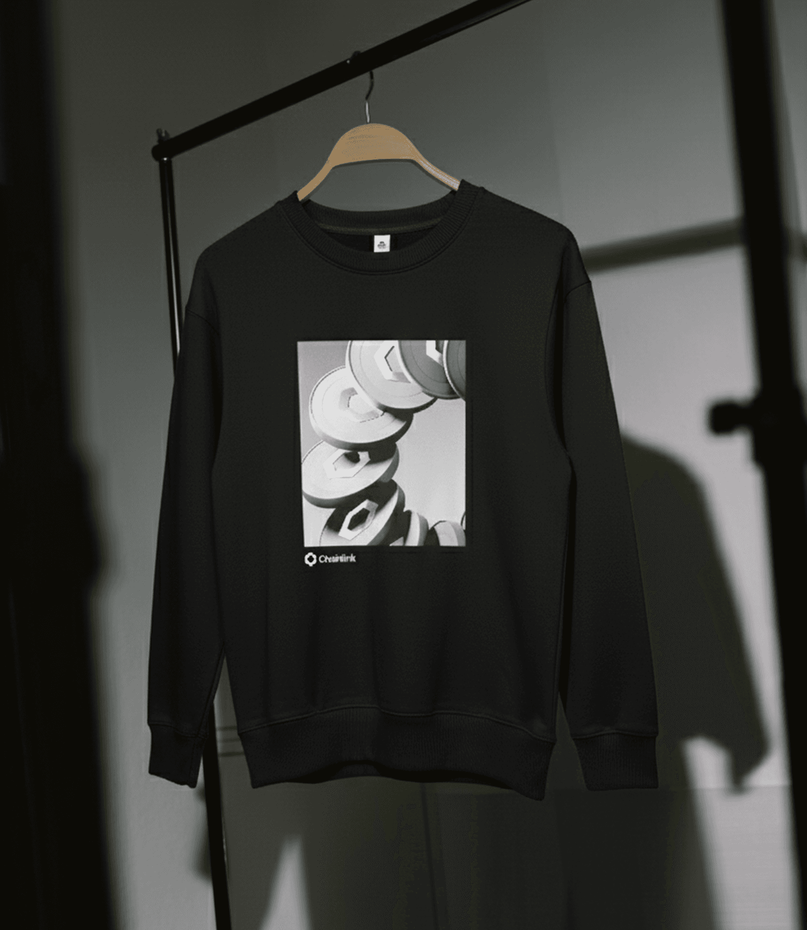 man wearing grey t-shirt standing in front of man sitting on chair