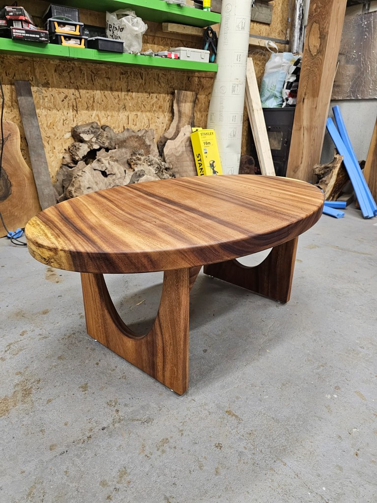 a wooden table topped with glasses and candles