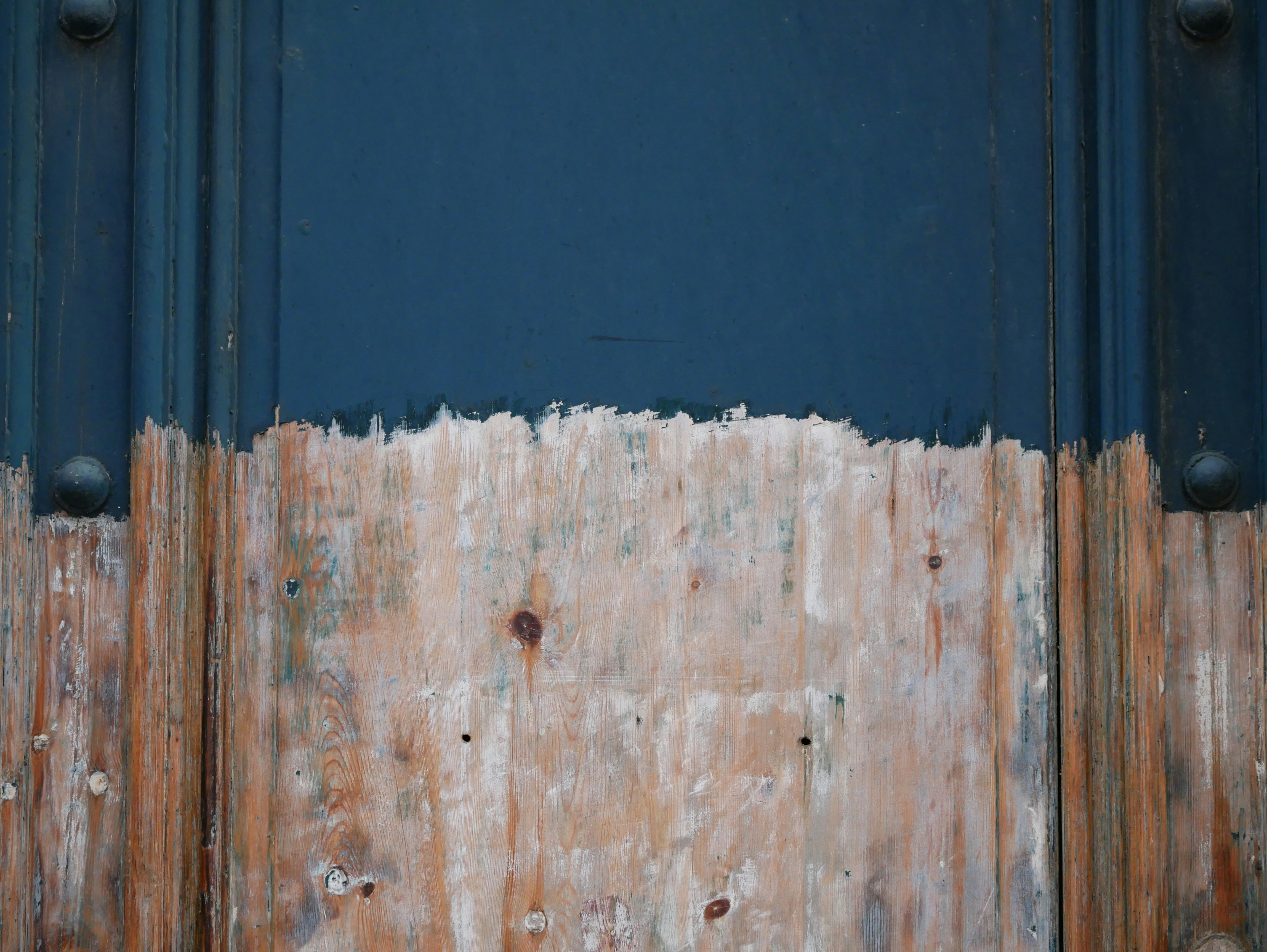 blue wooden door with white wooden door