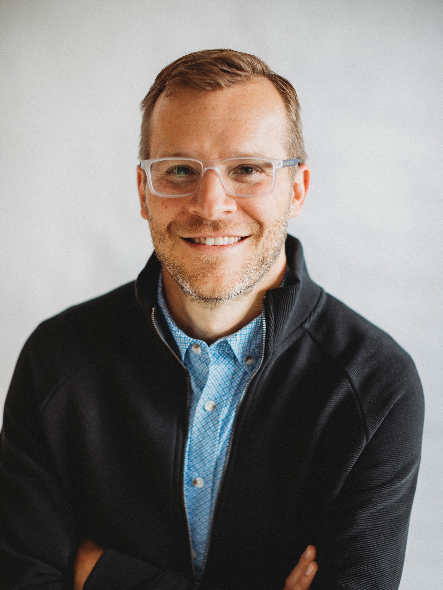 A medium-close portrait of Andrew Wolgemuth smiling.