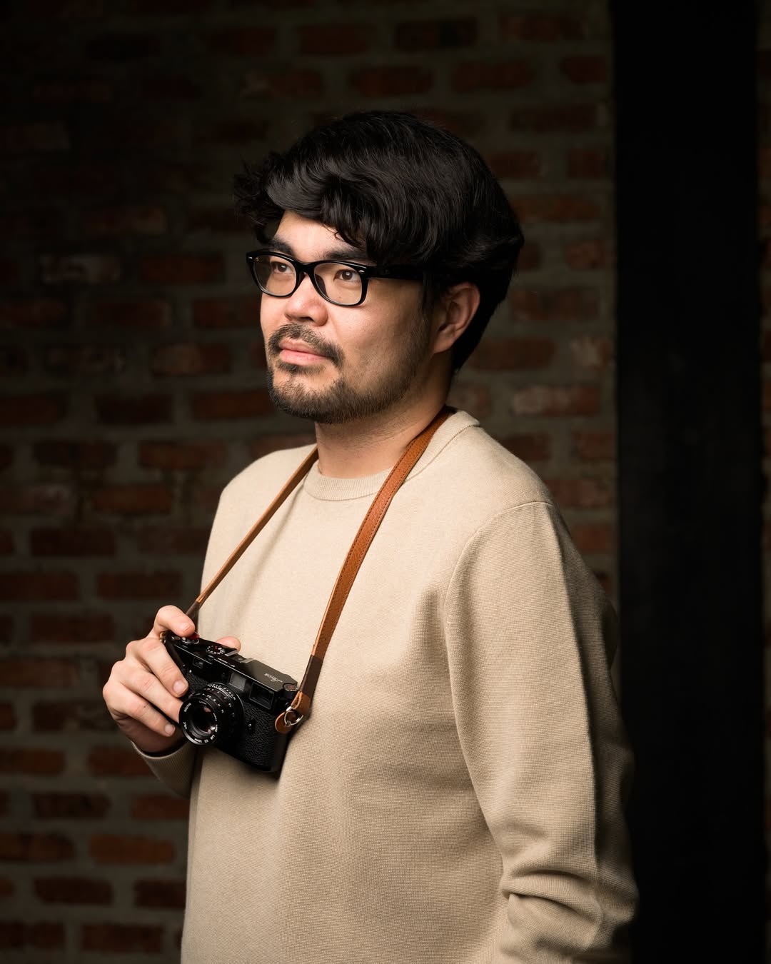headshot of male in dark background