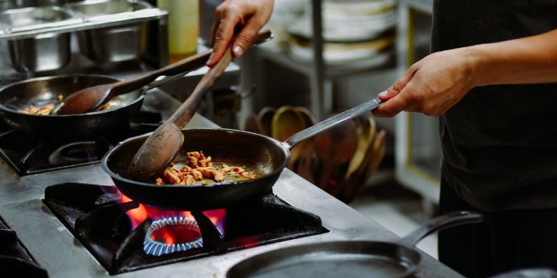 An F&B staff cooking food