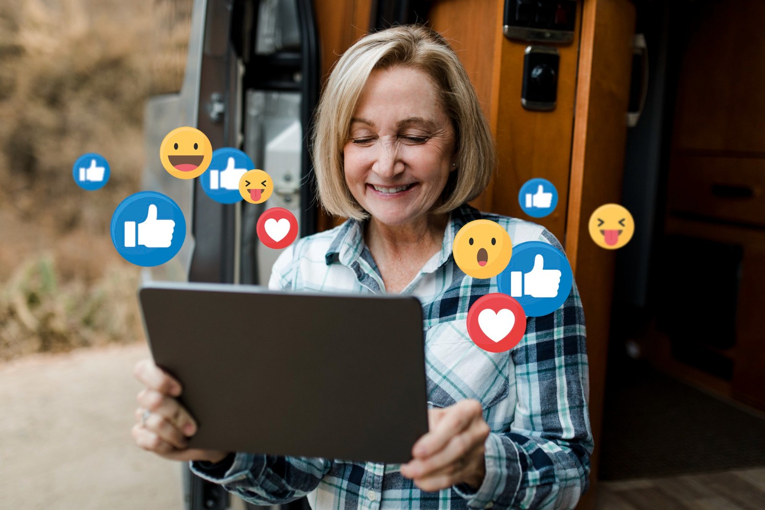 A woman holding a tablet displaying various social media icons, symbolizing digital connectivity and communication.