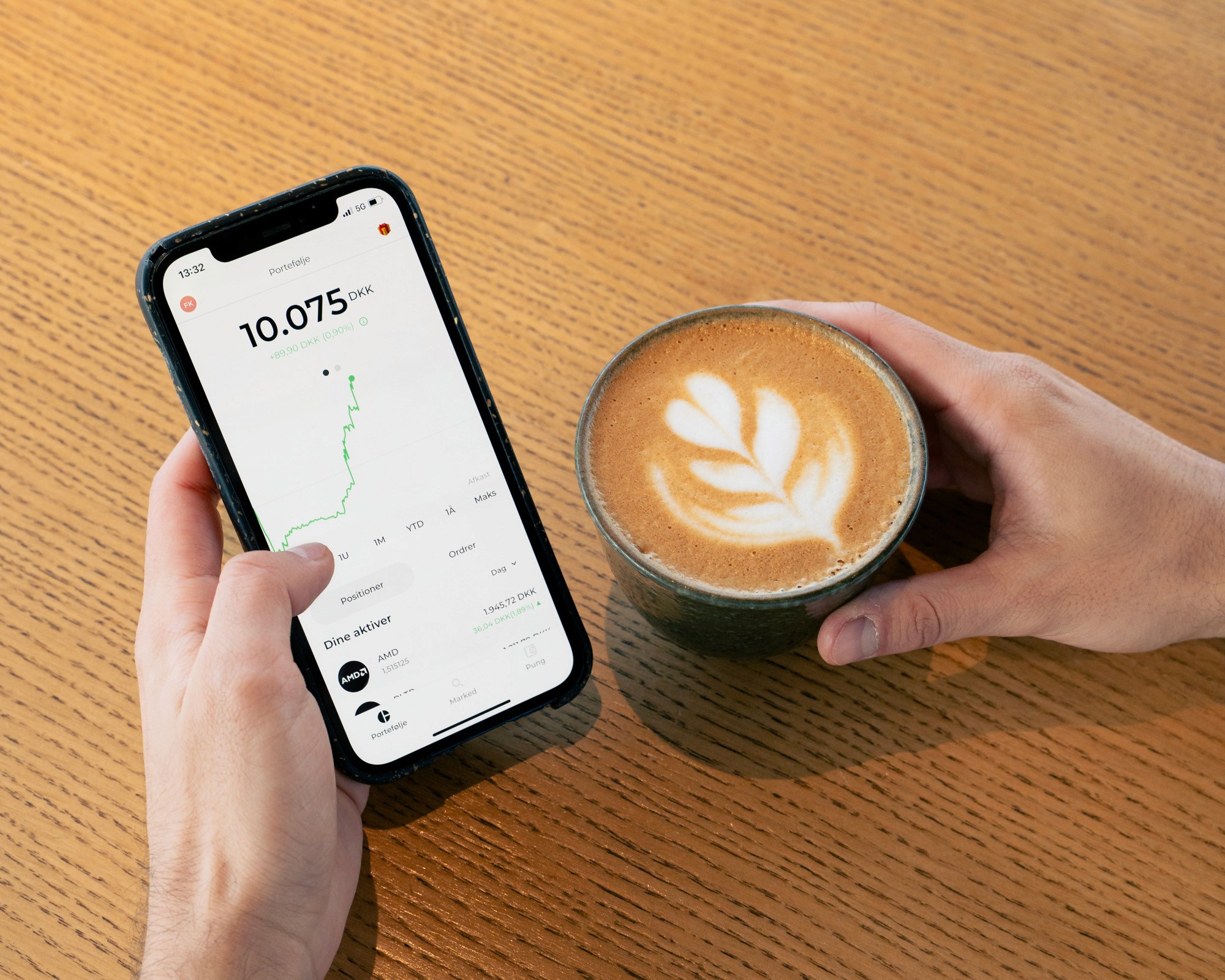 Pluto Markets app'en, der viser en porteføljes udvikling