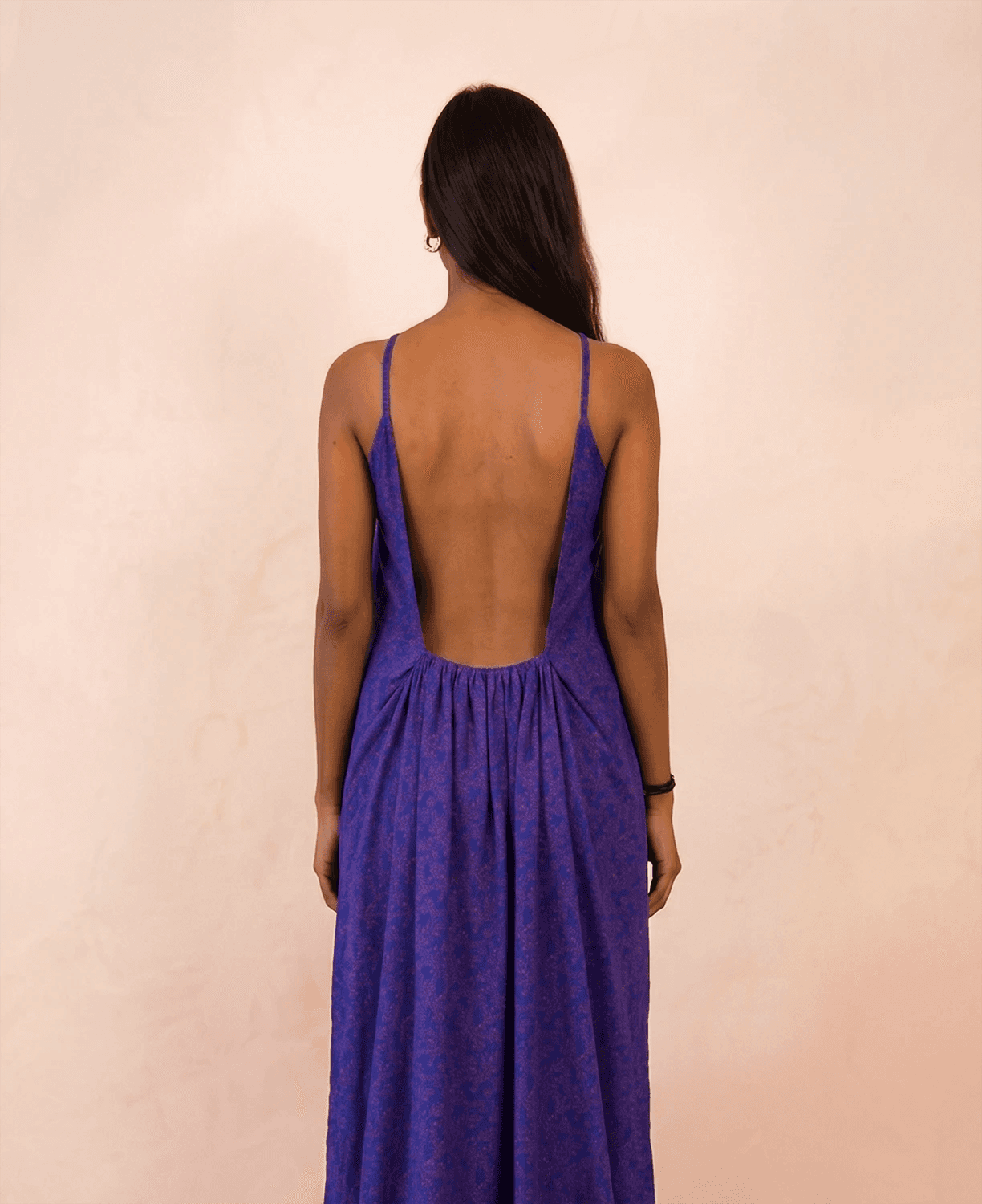 ZOYA is a one-of-a-kind slip dress handcrafted from a vintage silk saree, reimagined into something light, fluid, and enduring.