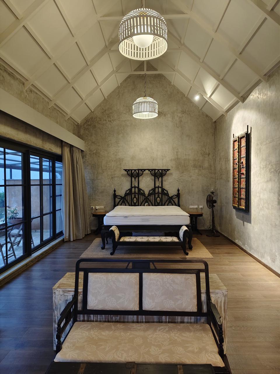 Curved-wood architectural interior with seamless arches, minimalist furniture, and soft natural light.