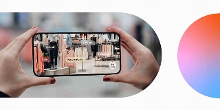 Hands holding a smartphone showing an augmented view of a clothing store indicating an immersive and interactive online UX.