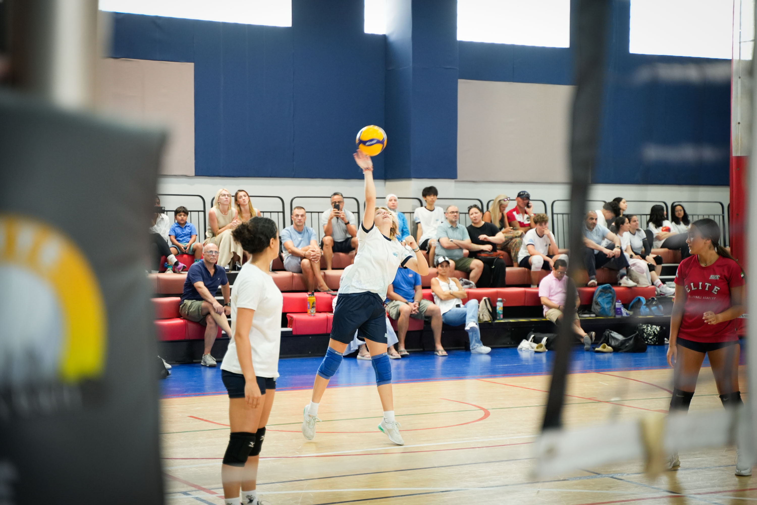 Students doing indor's Volleyball training