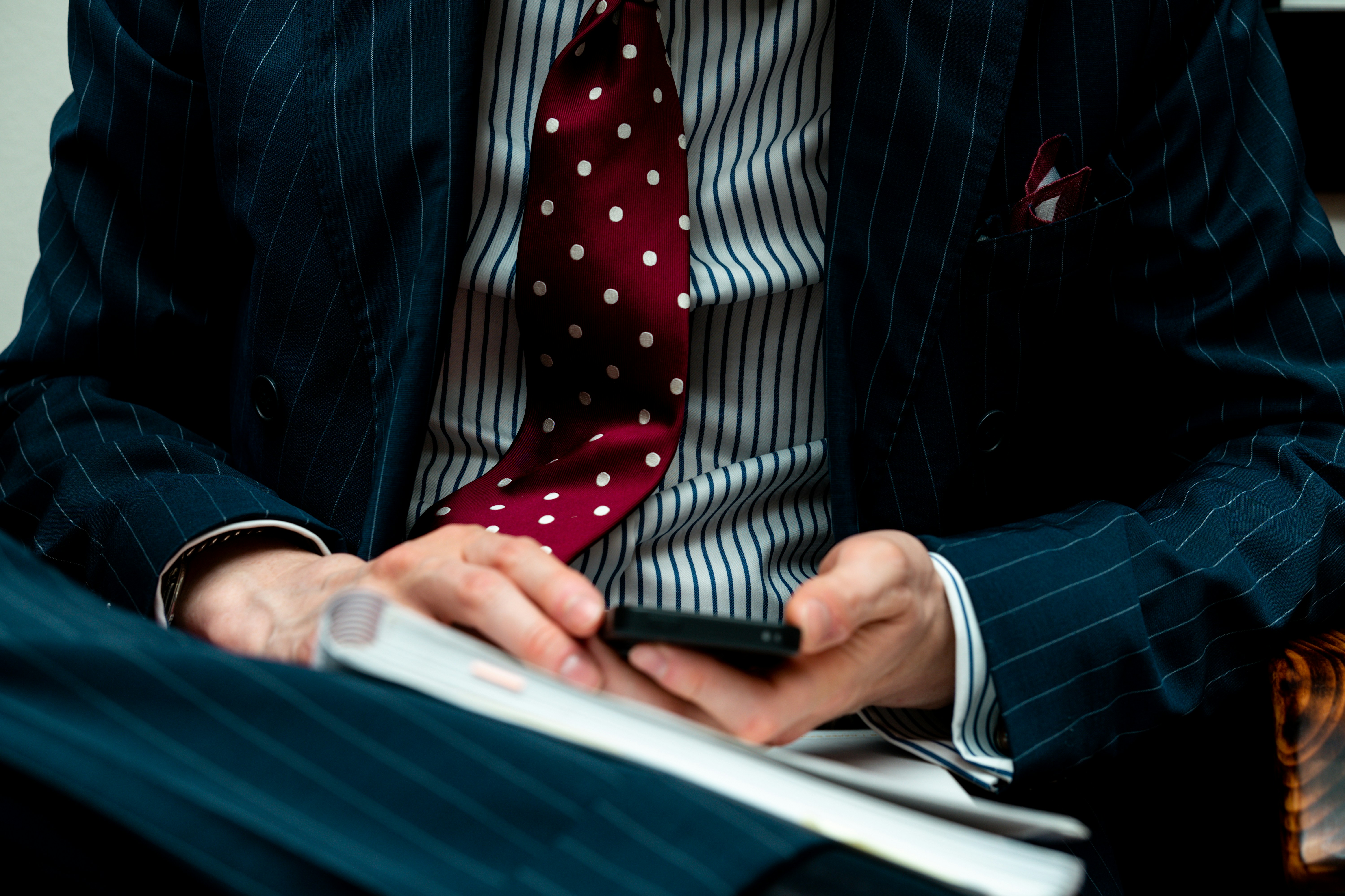 man in black suit jacket using black laptop computer