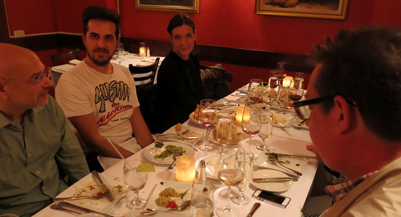 people sitting around the dinner table