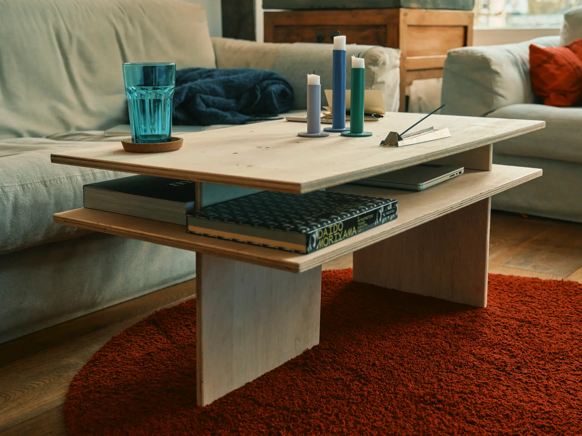 Plywood coffee table with a two-level top in a living room