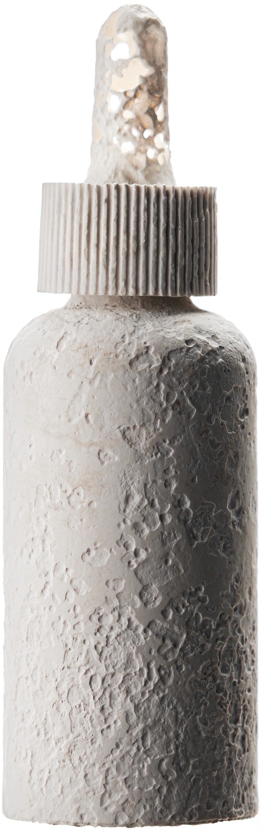 A biodegraded VIVOMER dropper showcasing the rigid bottle, threaded cap, and flexible bulb all returning to nautre together. Winner of the 2025 Pentawards for Sustainable Design, this Shellworks innovation engineers every component from the same plastic-free, home-compostable material, eliminating the multi-material waste typical of skincare packaging and leaving zero microplastics behind.
