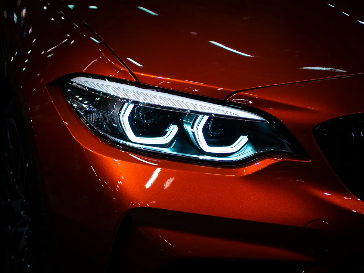 HyperAuto Care Headlight Restoration service in a professional auto care workshop