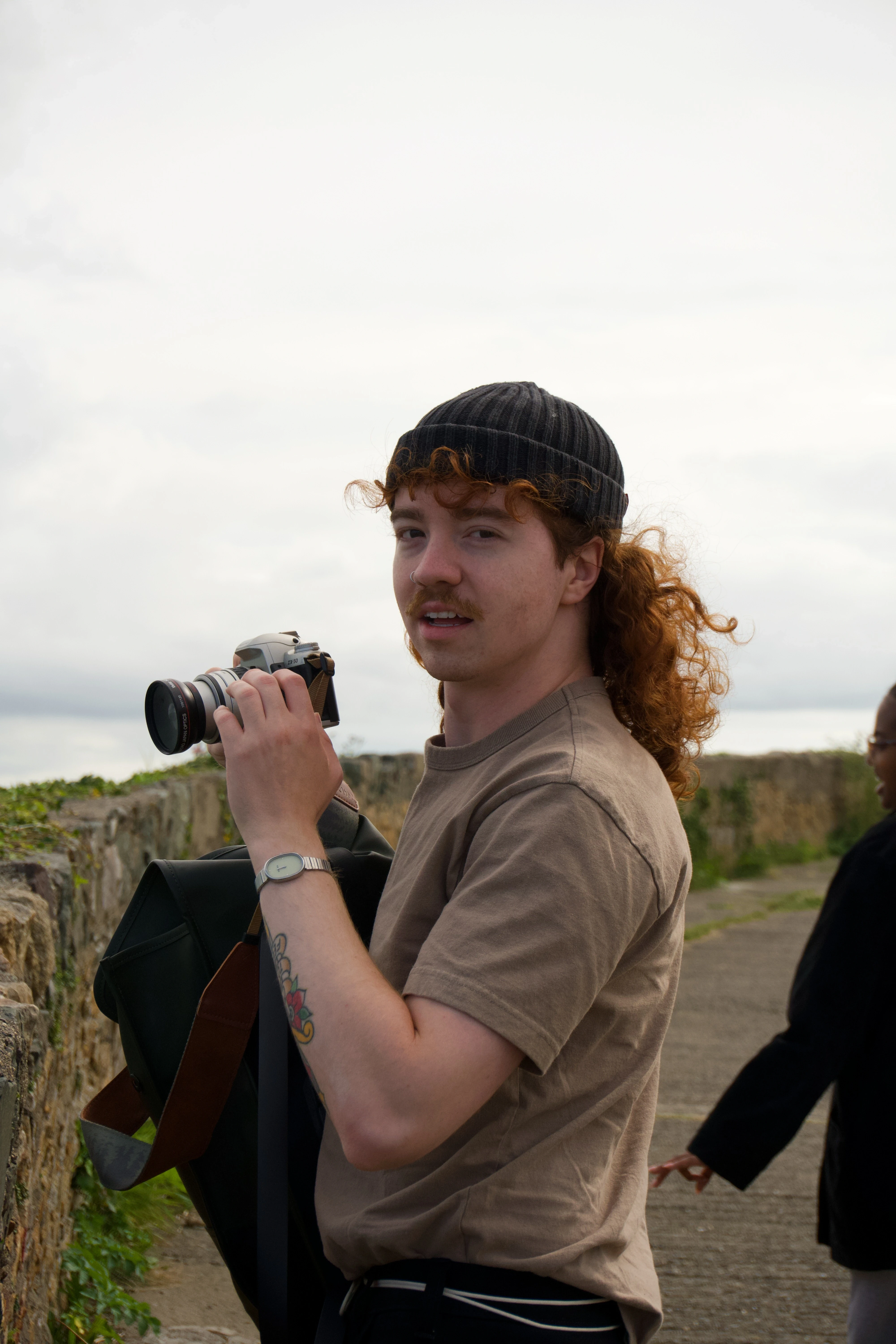 Gray Andrus-Merriner is on the job with film camera in hand