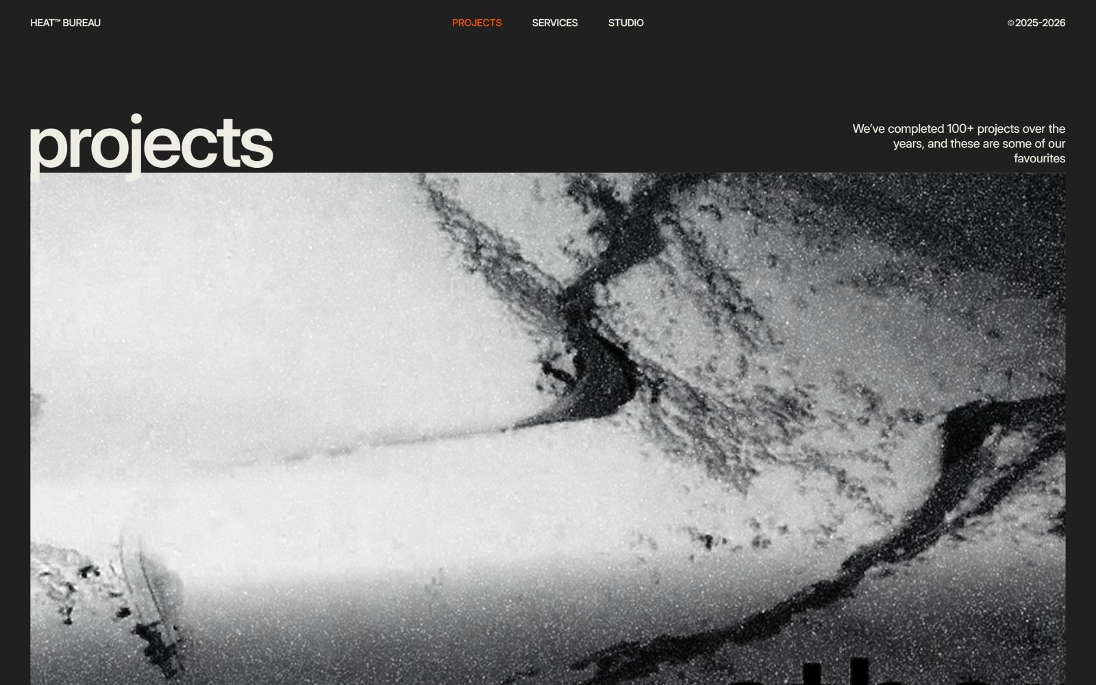 Black and white aerial image with abstract patterns. The text reads "projects" and "We've completed 100+ projects over the years...