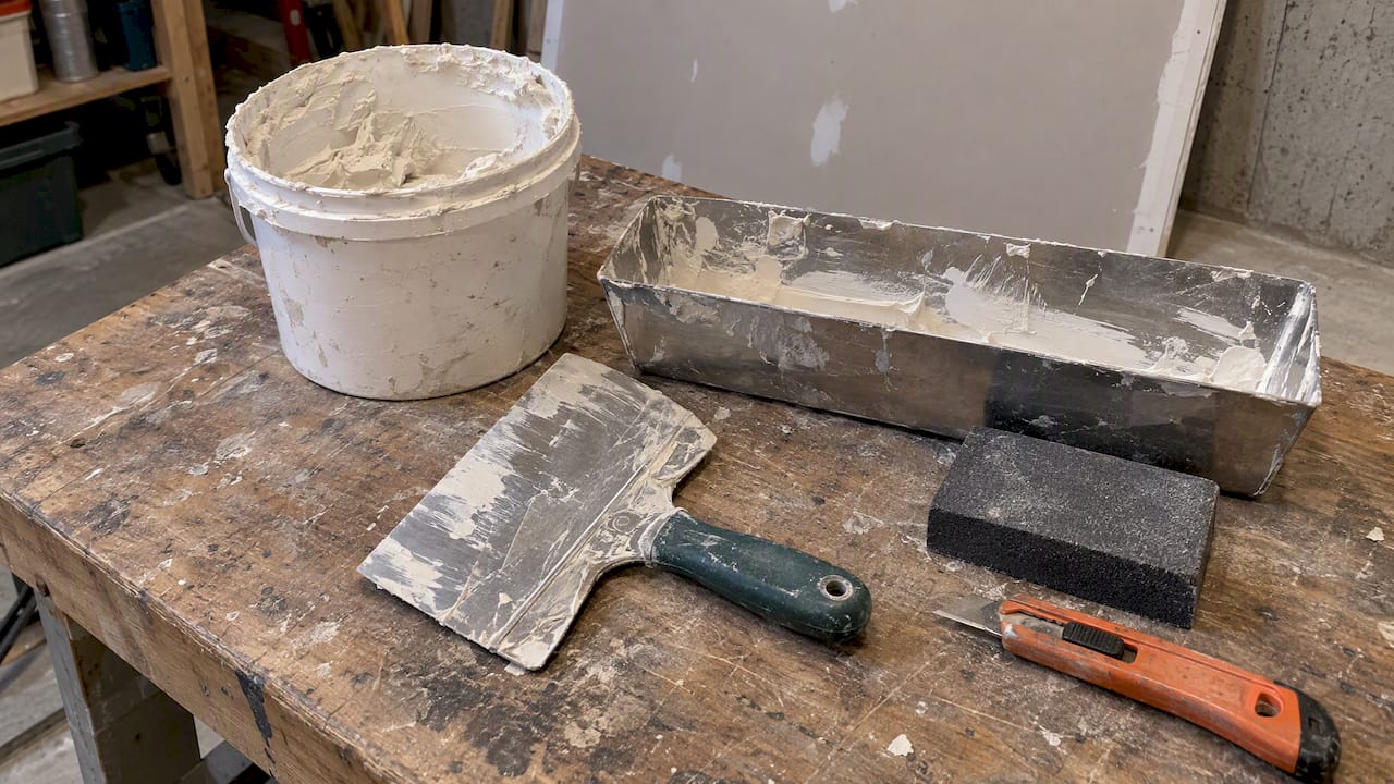Drywall repair materials and taping tools