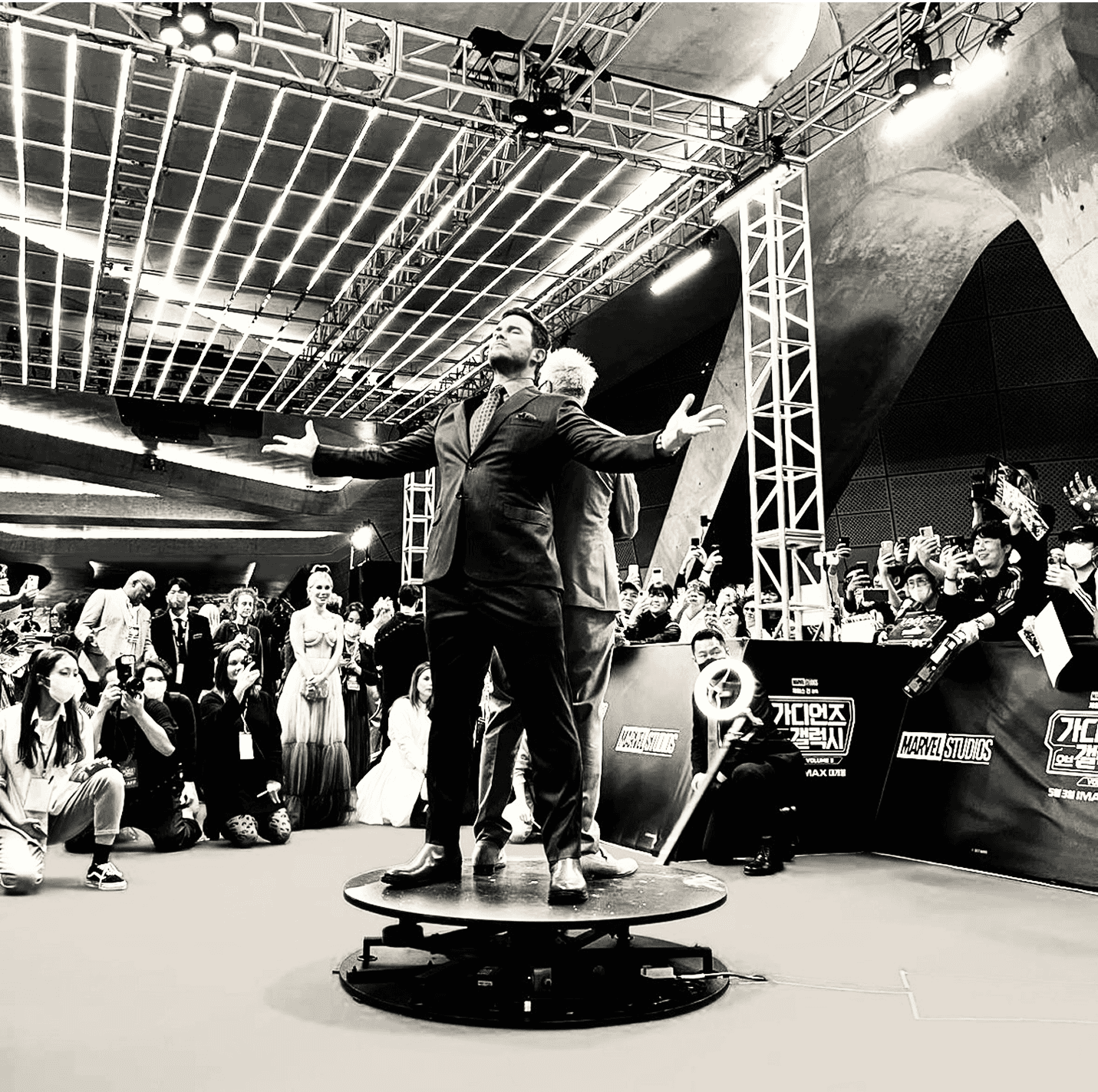 Close-up of two smiling friends with freckles, bright makeup, on a light blue background—joyful, inclusive brand portrait.
