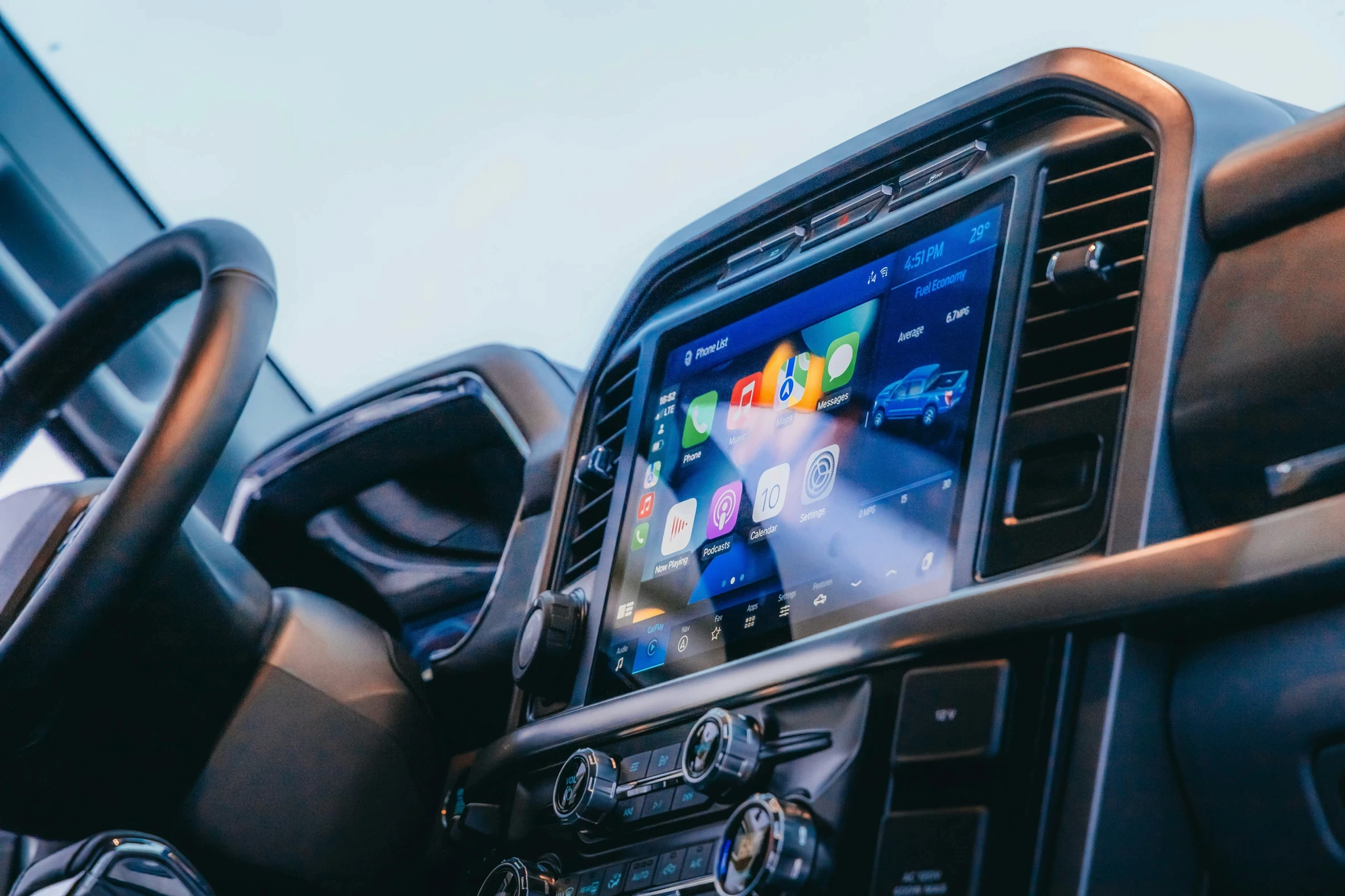 a car dashboard with a gps device in the middle of it