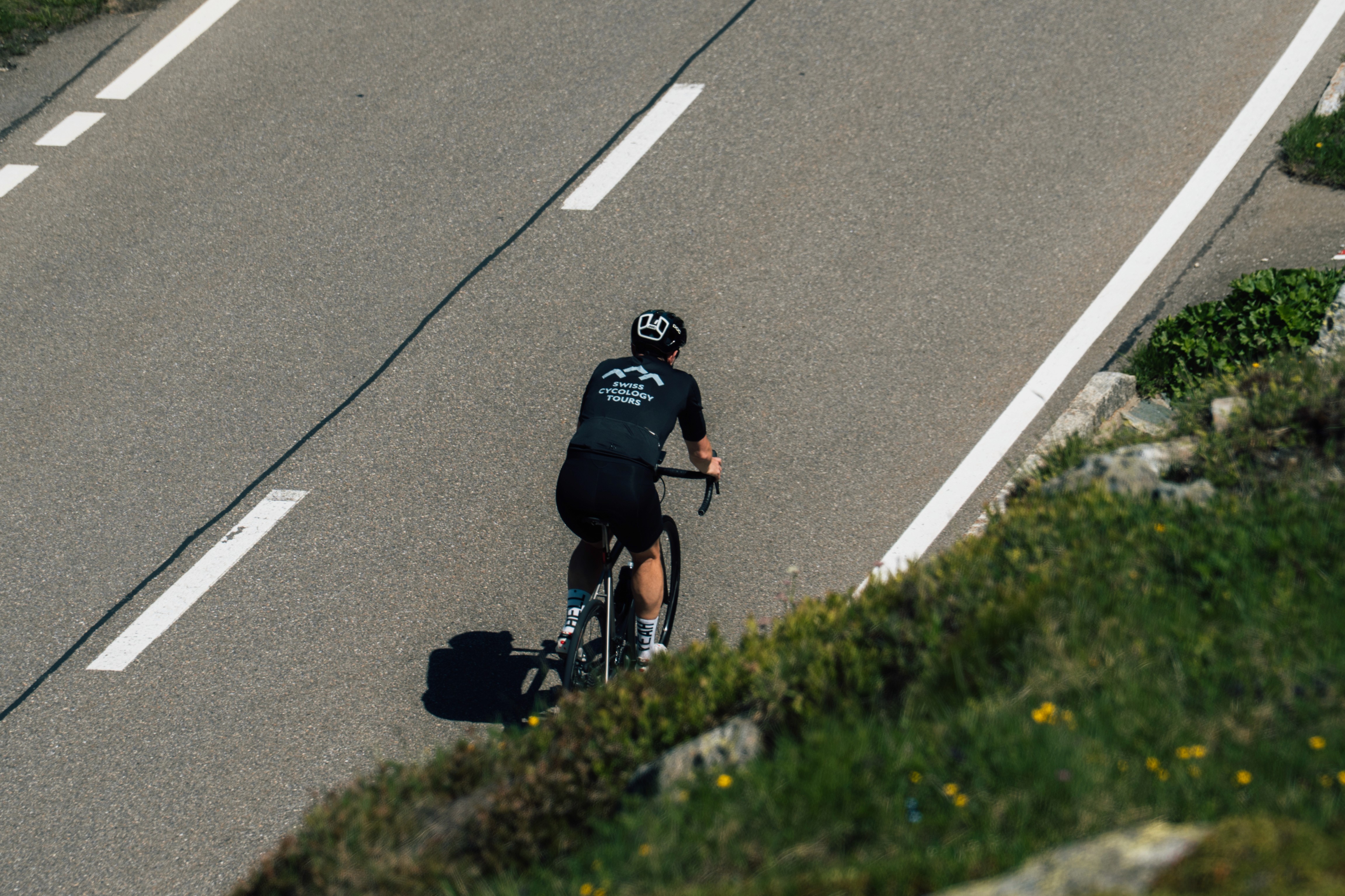 Cyclist riding in the Swiss Alps