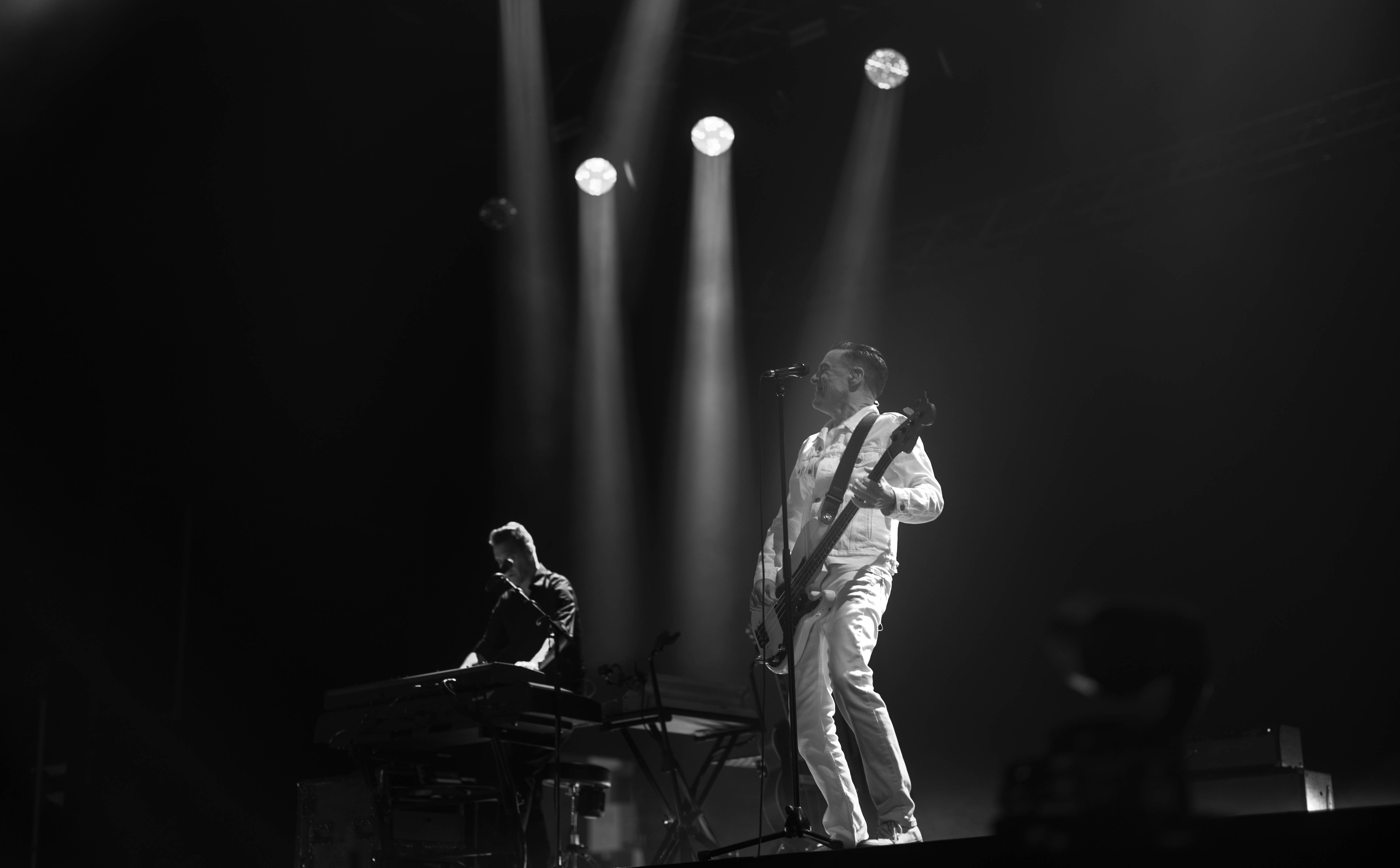 a woman holding a red flower