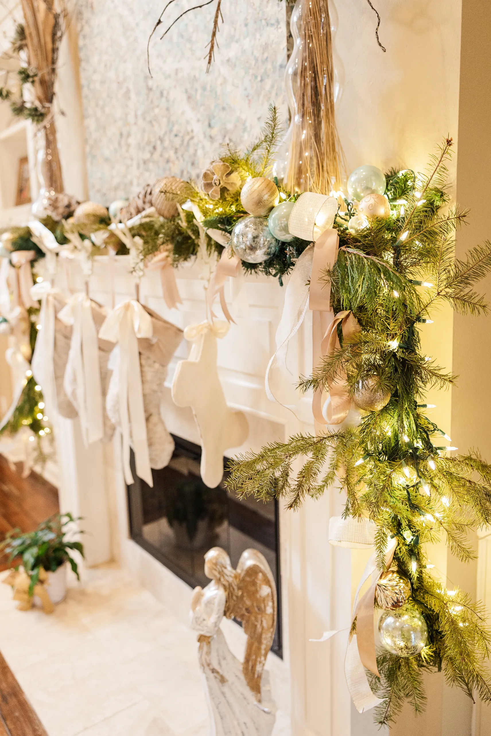Luxury table setting by Sarah Overall Events with pink embroidered napkins, gold-rimmed plates, floral arrangements, and personalized menus in Shreveport.