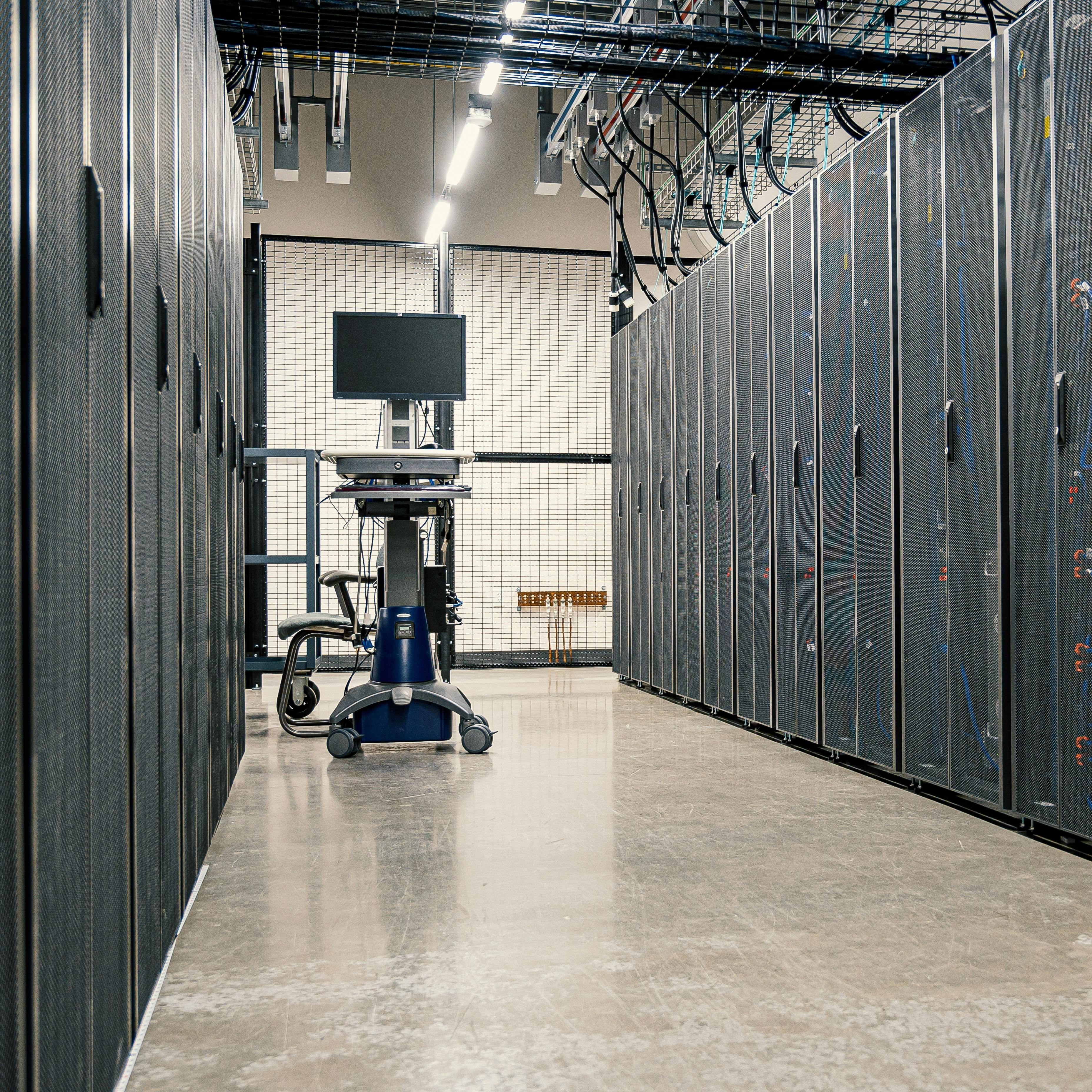 Rows of server racks and network infrastructure inside a data