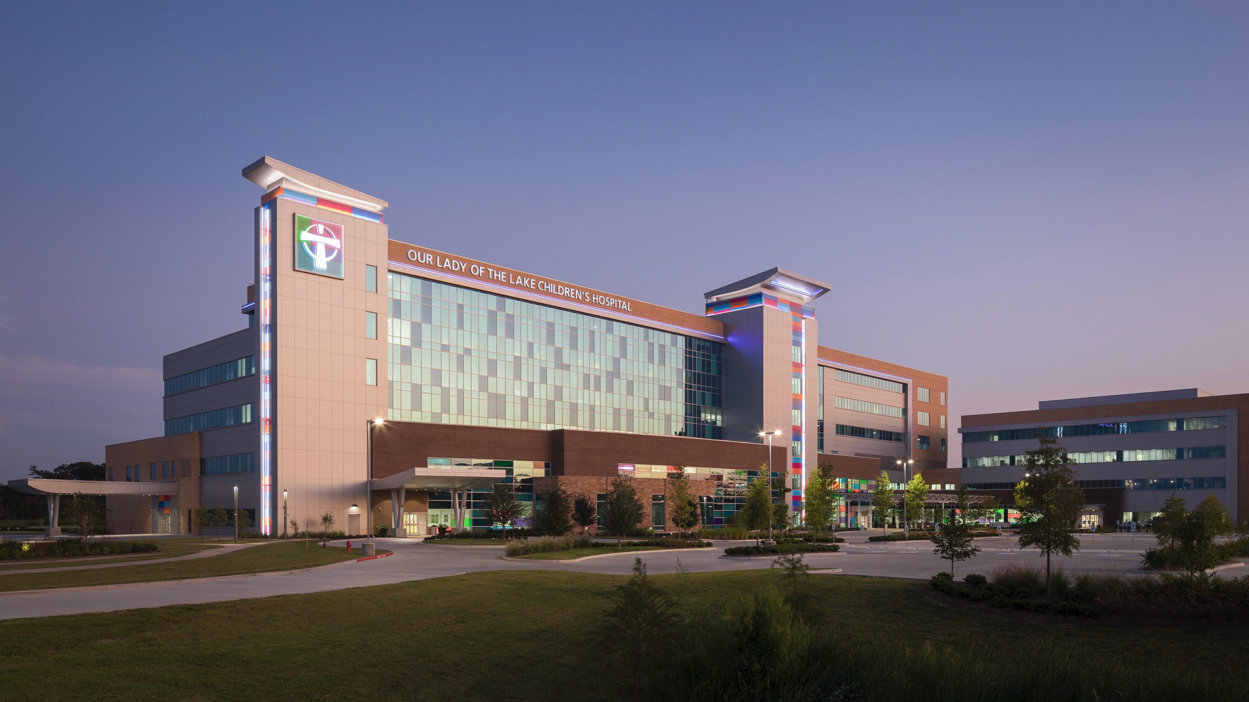 Our Lady of the Lake Children's Hospital building at dusk.