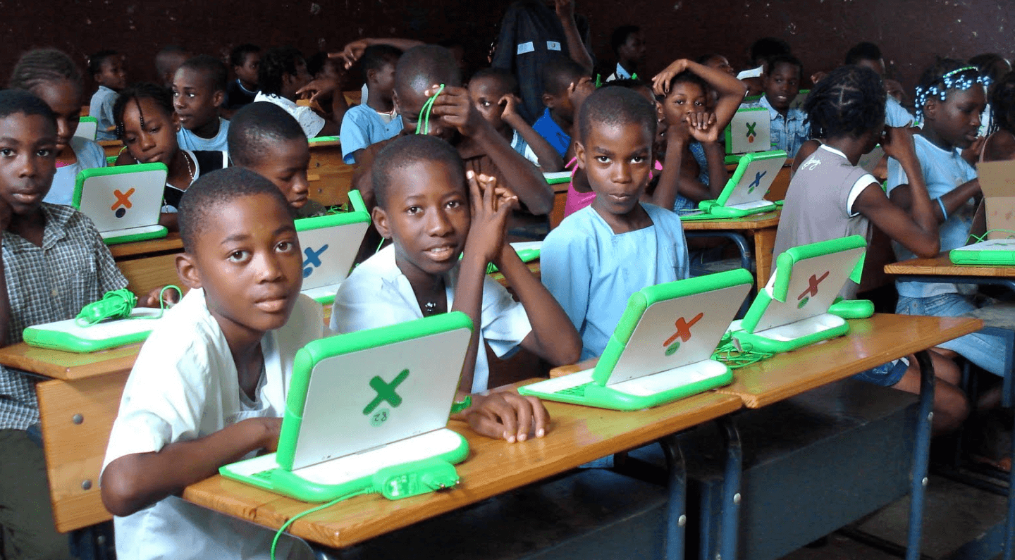 Classroom of children using laptop computers.