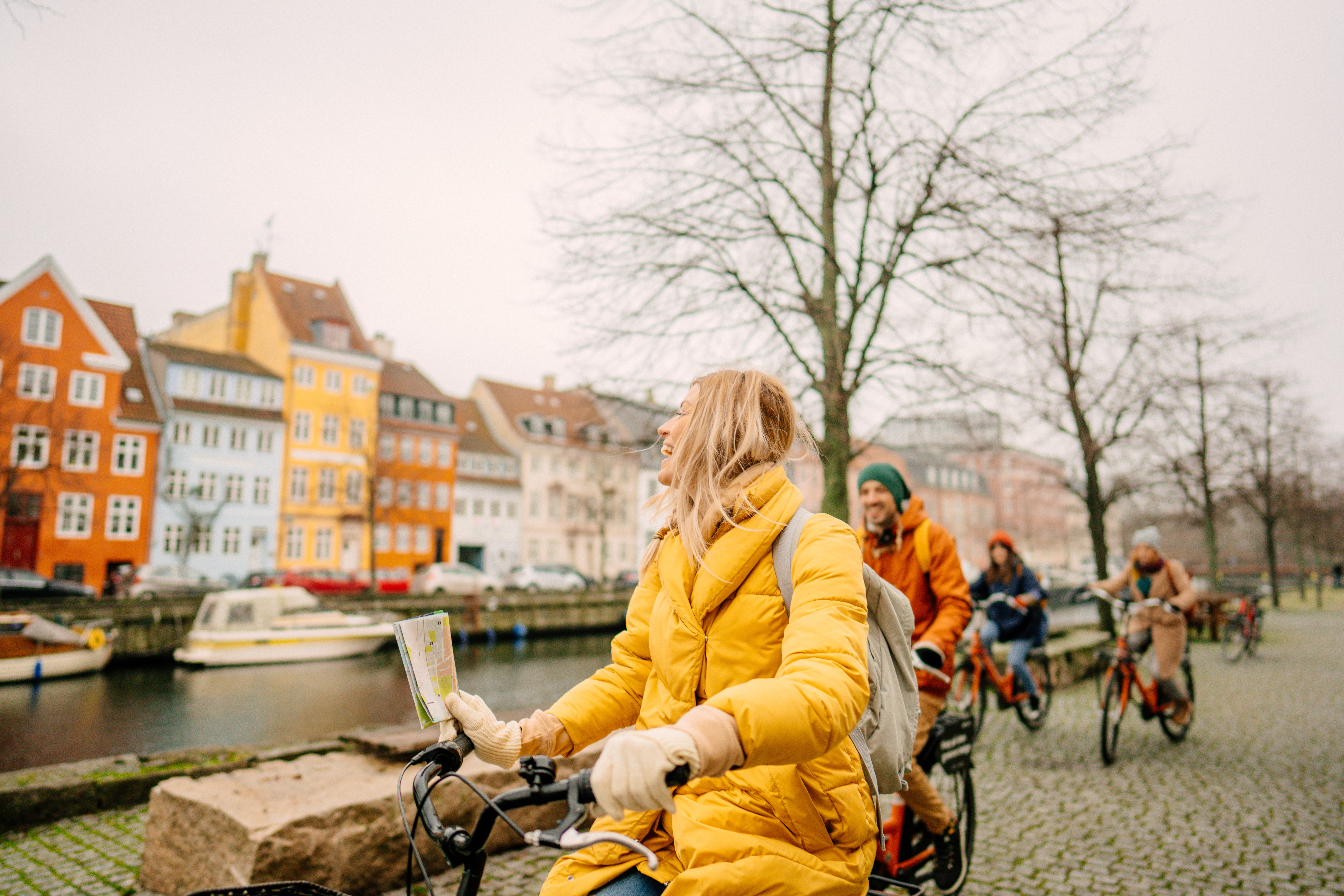 A group of people cycling through Copenhagen